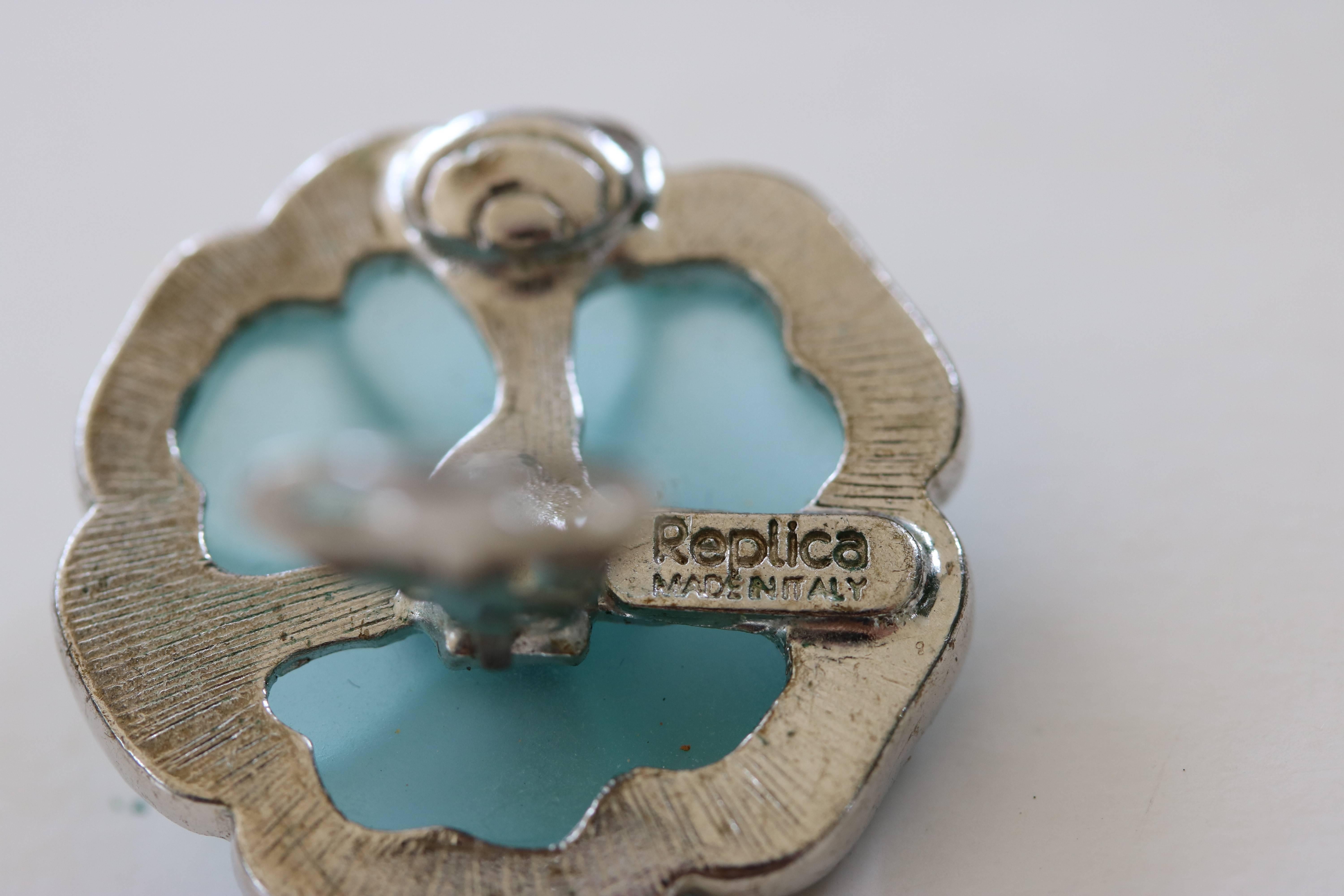 1980s stunning pair of Italian earrings Lalique Style in flower form with translucent aqua glass in silver plate metal with a CZ border and center by Republica.



