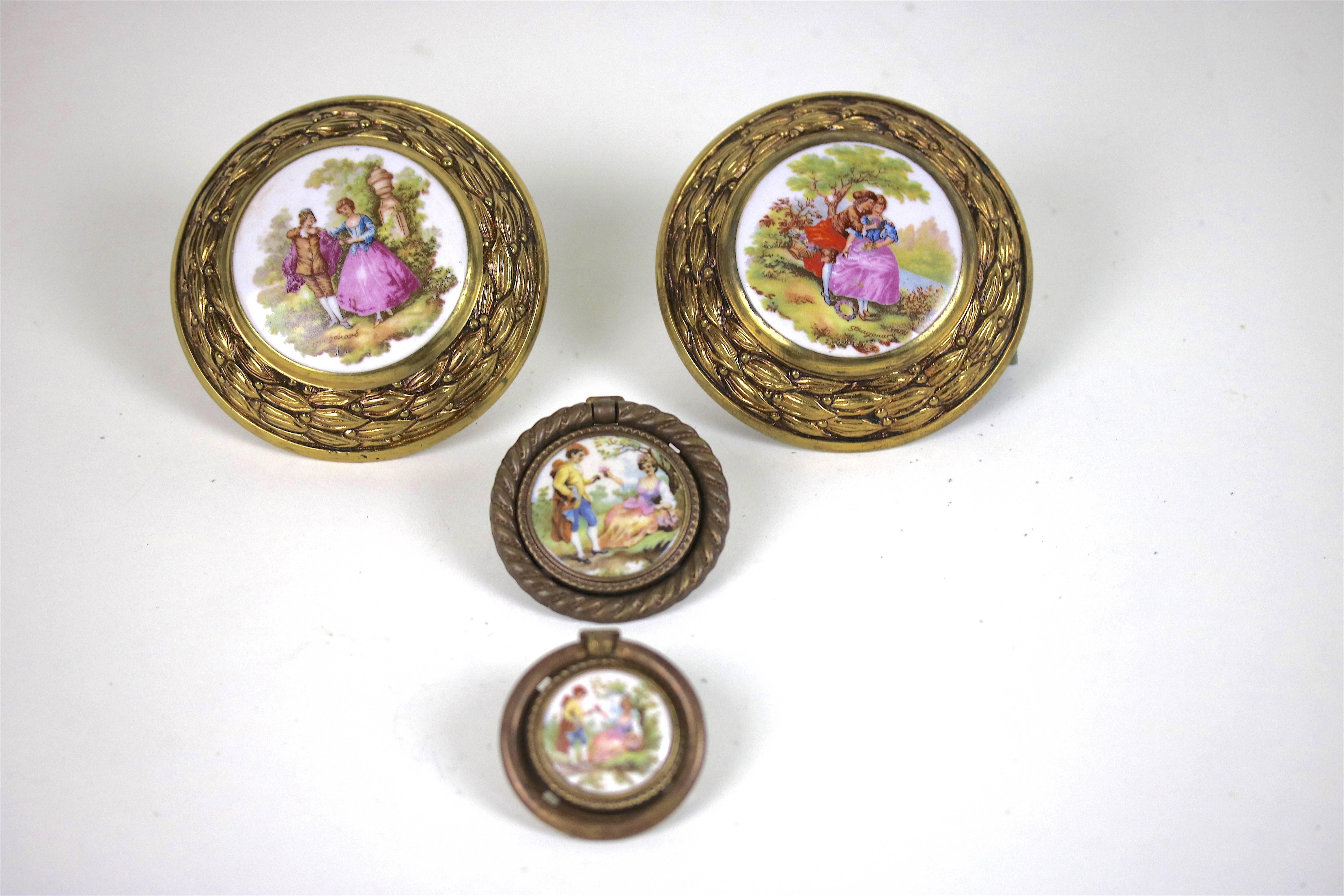 A beautiful large pair of French Fragonard signed porcelains in a highly decorative brass frame can be used for a door pull or drawer pull or drapery tie back-there is also a pair of smaller antique coordinating drawer ring pulls with Fragonard