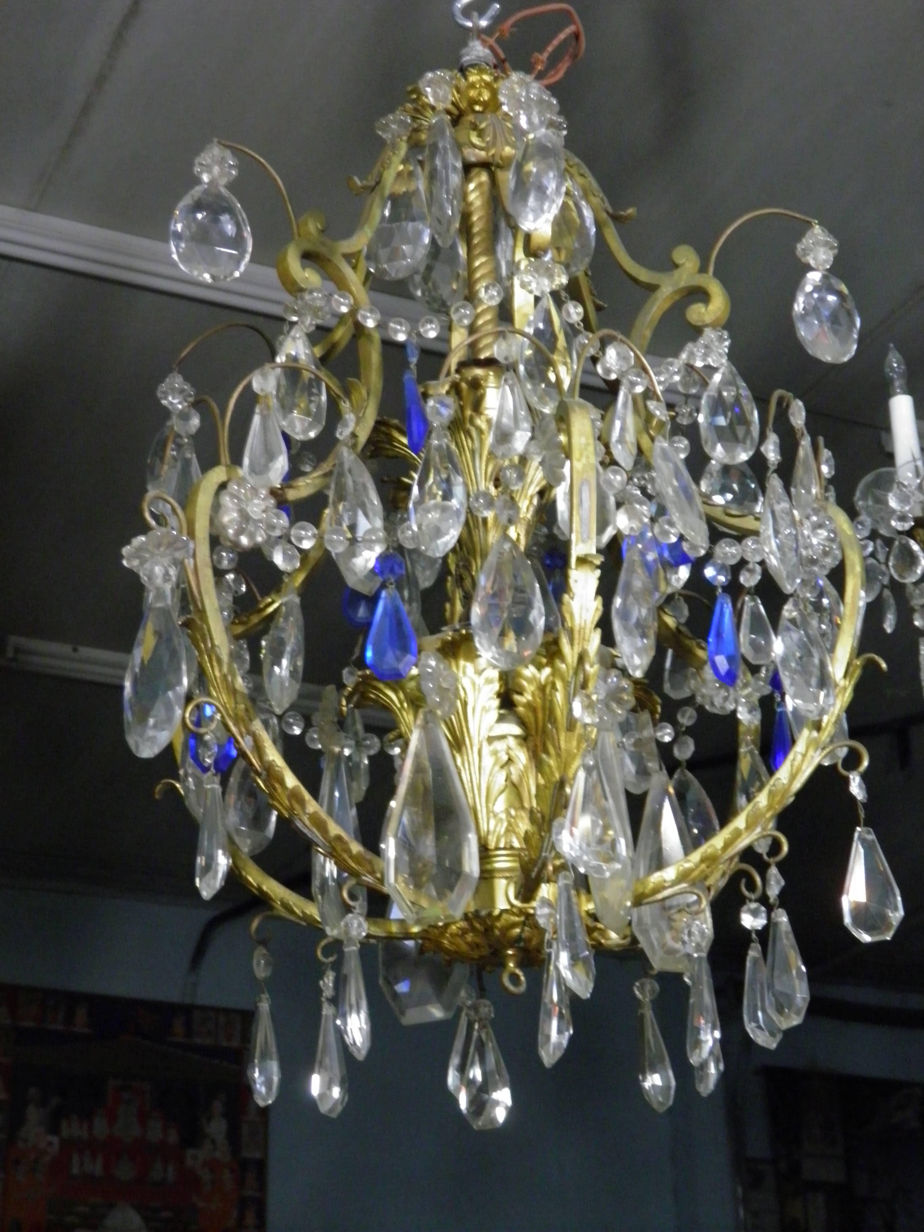 Live like a Rockefeller, celebrate Style and Vitality! So many gleaming blue and clear crystals hanging on this chandelier and 2 tiers of 5 each light bulbs- this chandelier is breathtaking!

Inspired One of a Kind Extraordinary Design of a Belle