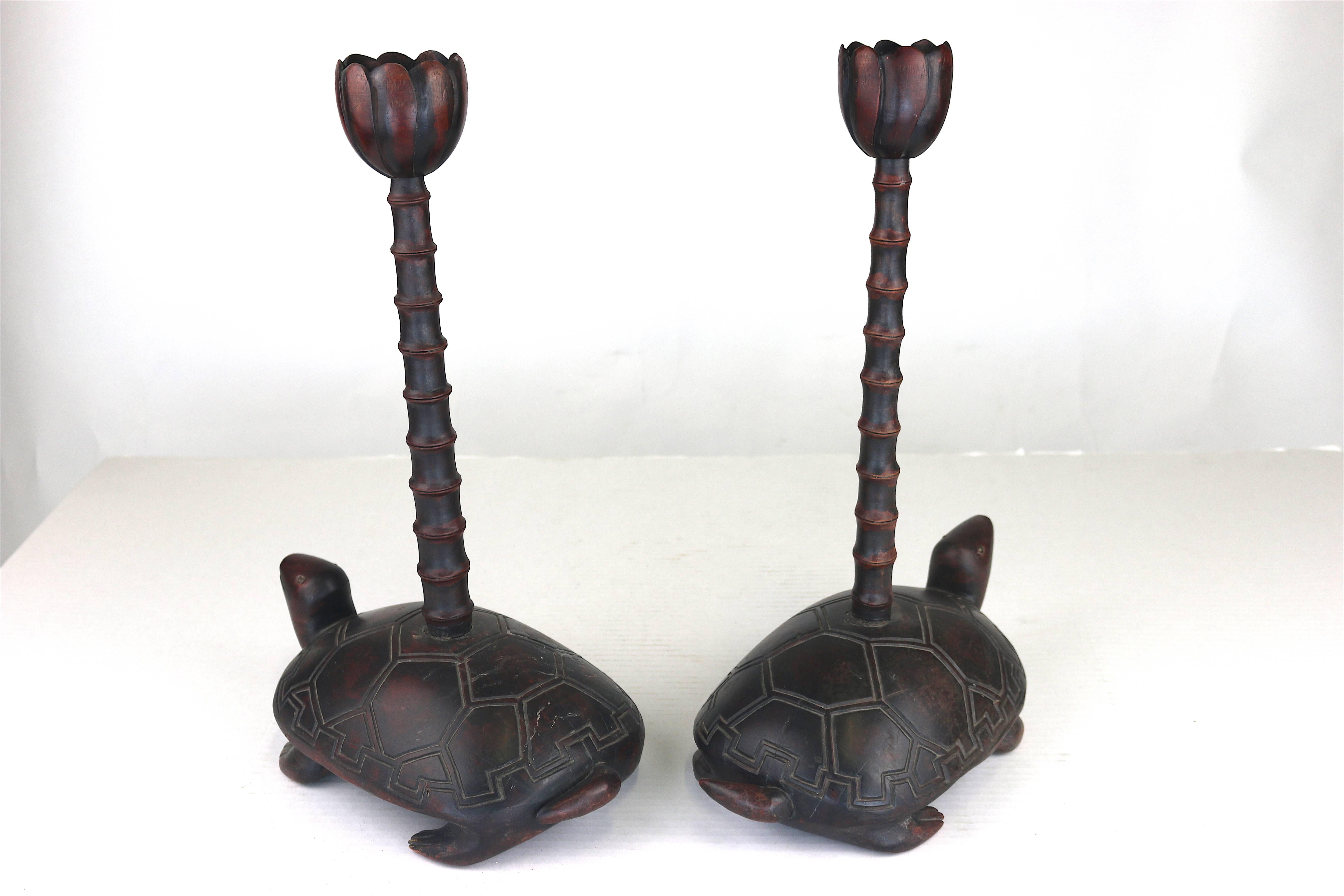 Distinctive early to Mid-Century wood carved turtles with bamboo poles topped with lotus leaf cupped candleholders.

A fantastic look for a console or dining table.

From the Edith Hale Harkness Estate--America's Early Society Heiress to
