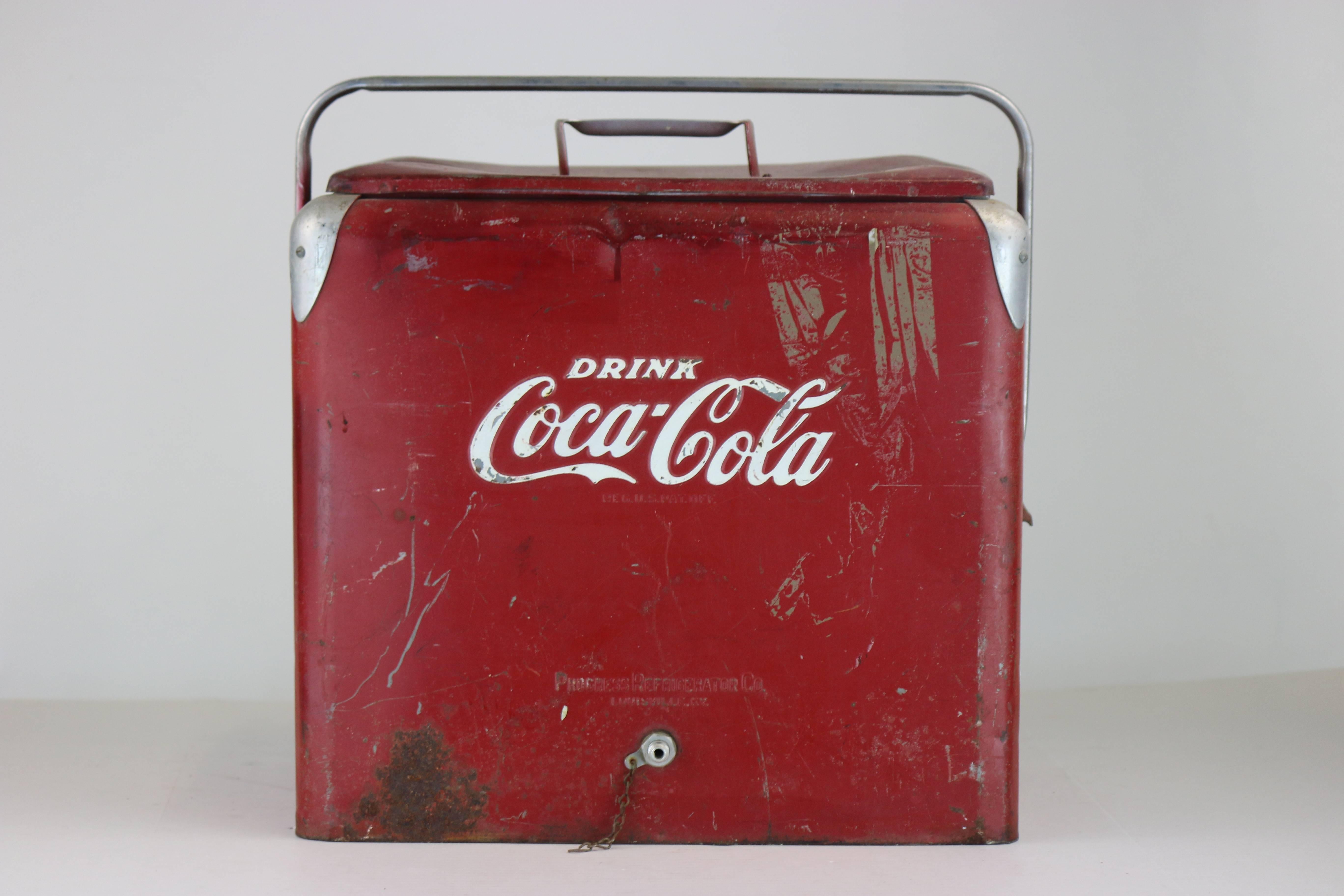 1940s aluminum vintage and Classic Coca-Cola ice chest by progress refrigerator Co. Louisville KY. Good interior condition-top a bit misshapen-aluminum handle.
Looks cool and retro Mid-Century as is, or can be a perfect candidate for