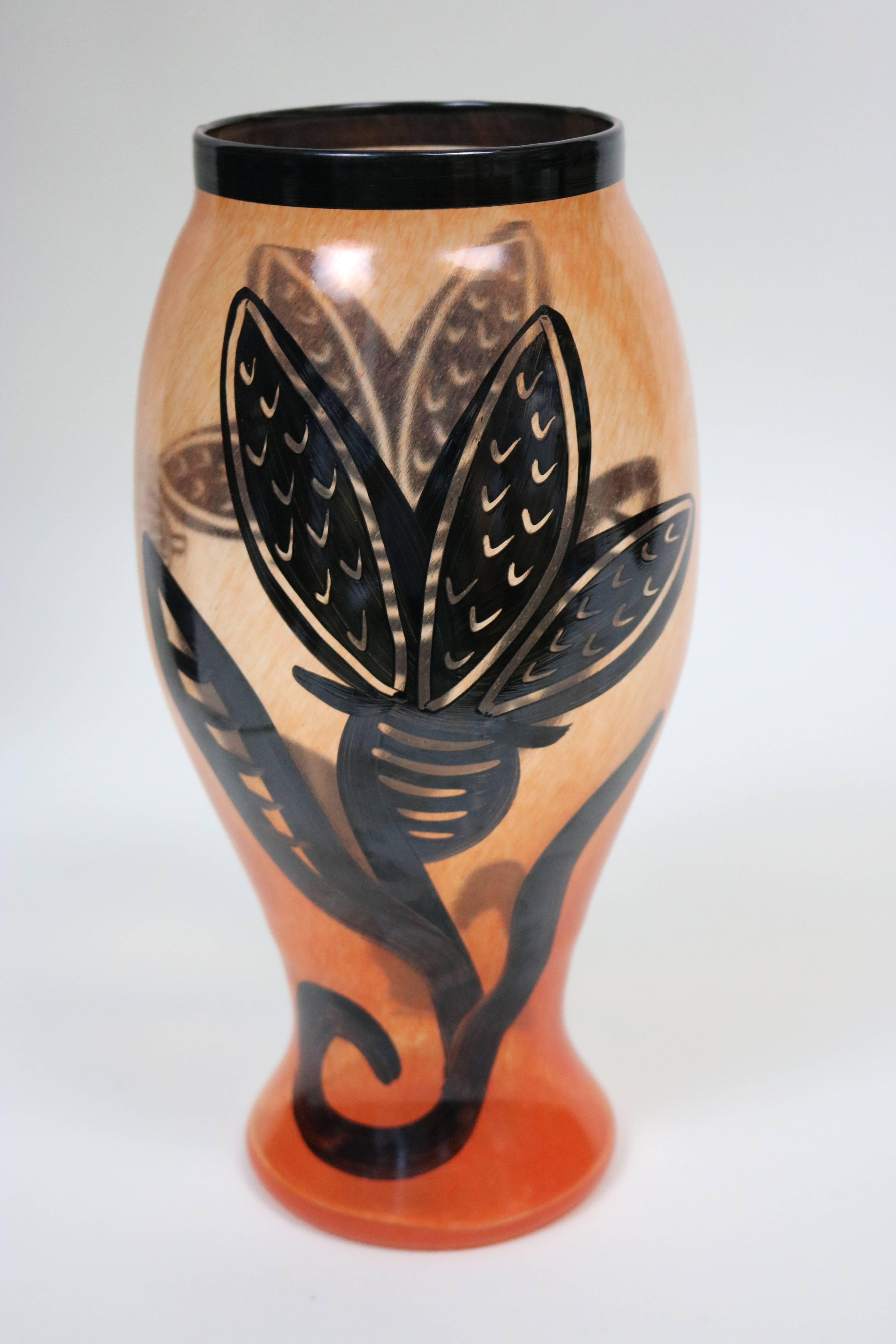 1980s Kosta Boda great large scale art glass vase by artist Ulrica Hydman-Vallien. Gorgeous apricot colored blown glass with large scale hand-painted flower on both sides with a lucky lady bug-
signed by the artist Vallien with Kosta Boda