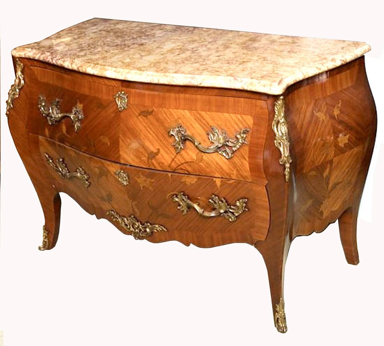 A very fine Connoisseur style 19th century French large commode with ormolu mounts in kingwood, rosewood and floral marquetry Bombe Chest of Louis XV style, second half of the 19th century of serpentine form, the serpentine shape marble-top above