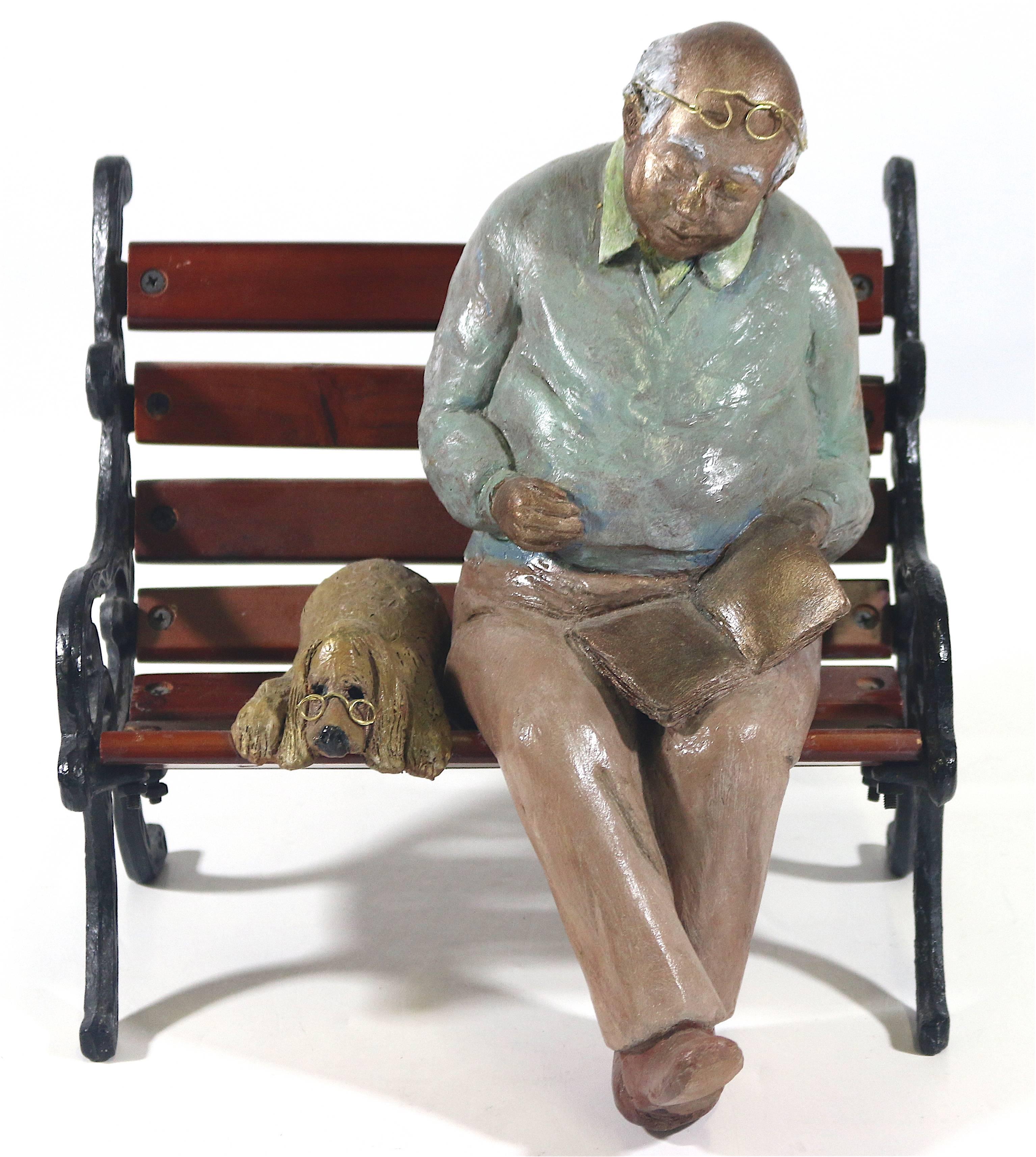 Man and his dog, what is a more poignant scene!
A 20th century bit of whimsy in a charming mixed media sculpture bronze, wood, metal an Inspired image of a man of experience with his faithful wise dog and his favorite book taking a respite on a