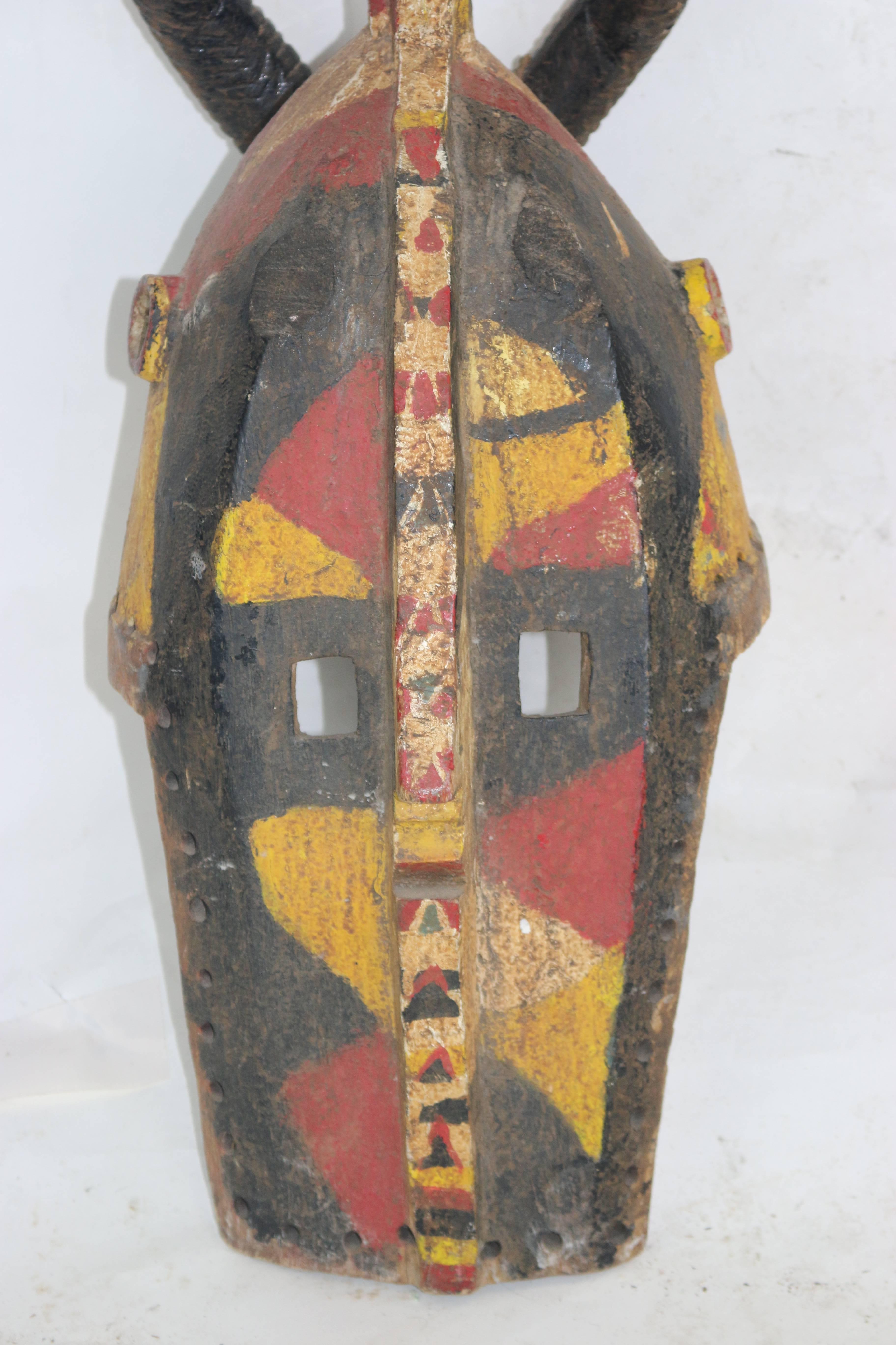 20th Century Powerful Tall Wood African Carved Pigmented Mask  For Sale