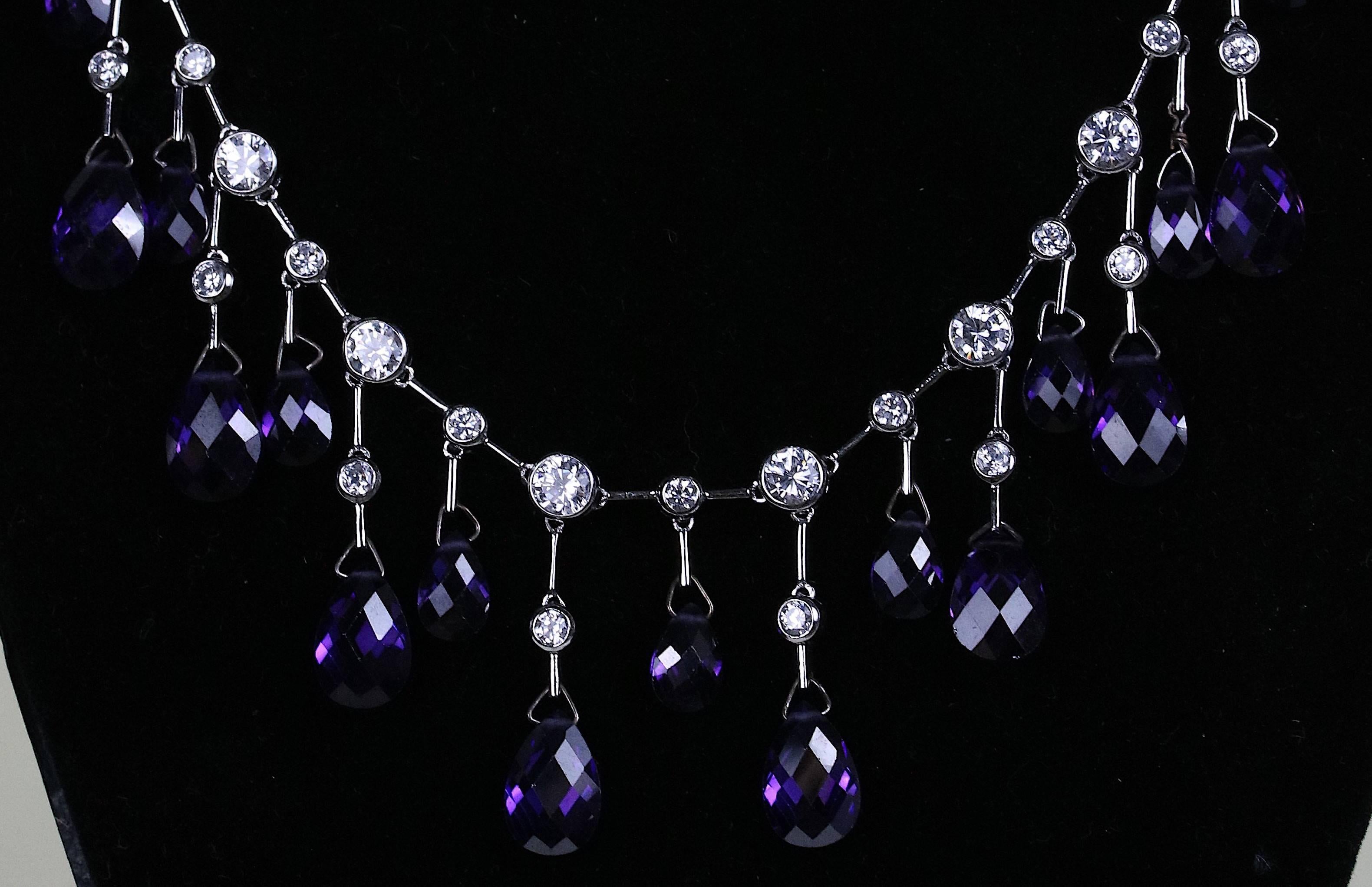 Stunning modernist fringe sterling silver necklace, featuring 16 amethyst briolettes drops; each drop holding one teardrop Briolette and a round CZ, the necklace banded with inter-spaced small and large round CZ's with a sterling silver bar chain
