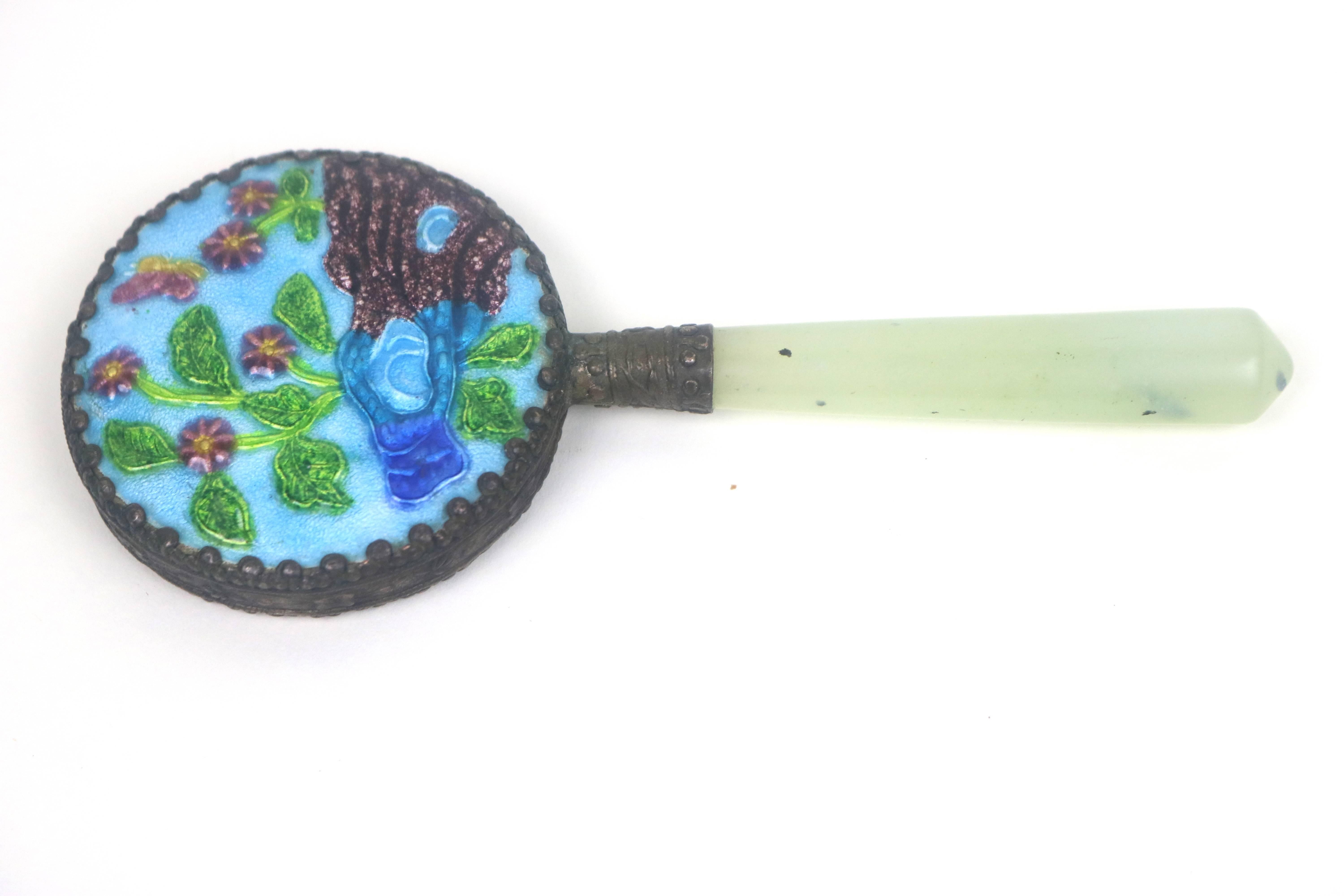 Makes A Marvelous Gift!
Small Lovely 1930's Chinese patinated brass filigree trimmed mirror  and handle with traditional Chinese design of enamel decoration of red flowers,green leaves and blue ponds and land on a background of blue guilloche enamel