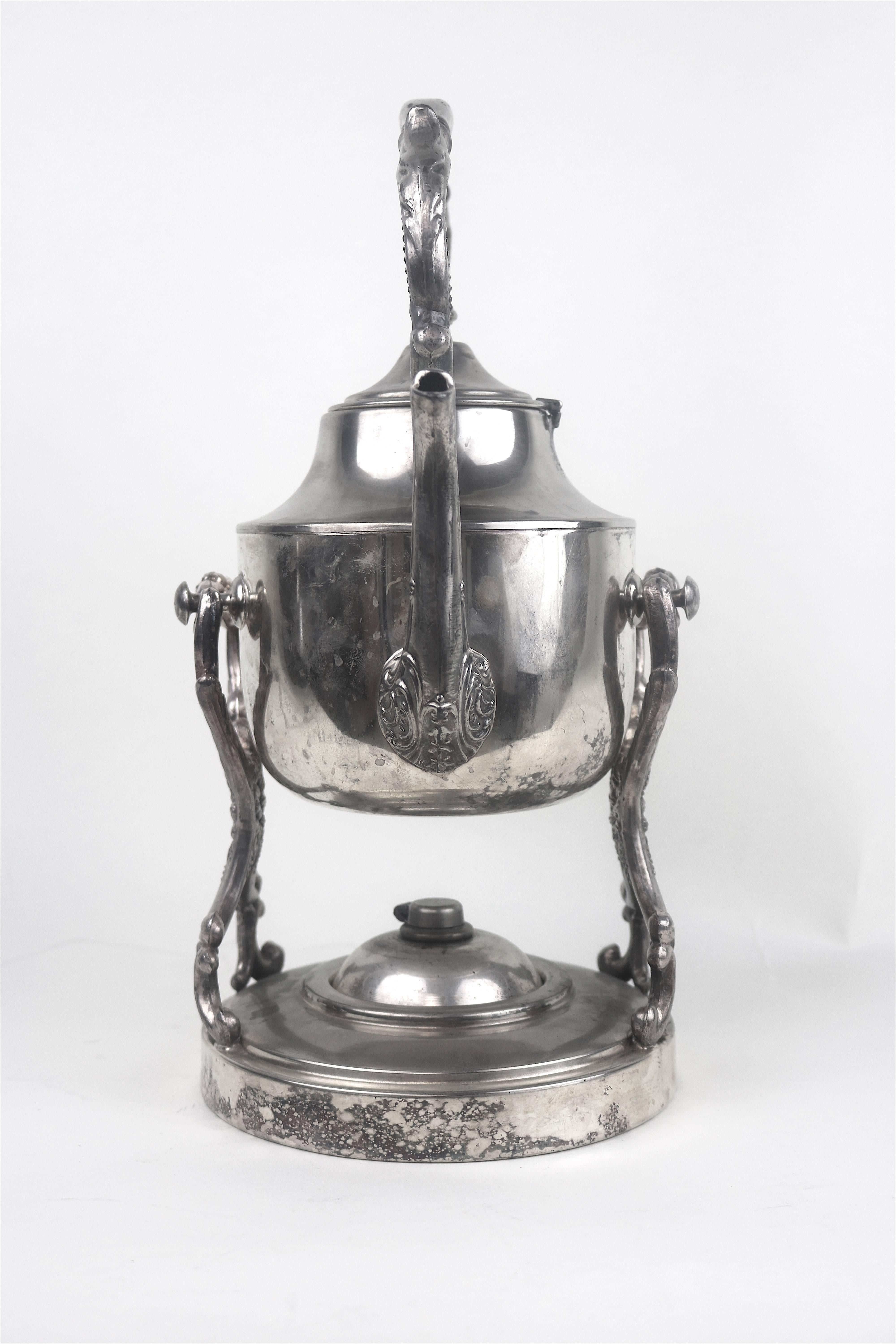Georgian Style Silverplate Spirit Water Kettle--Tilt the pot while in the cradle a lovely feature to serve coffee tea or hot water-burner underneath the pot to keep liquids warm.
Made to impress on Your Party Table!!
Beautiful engraved repousse