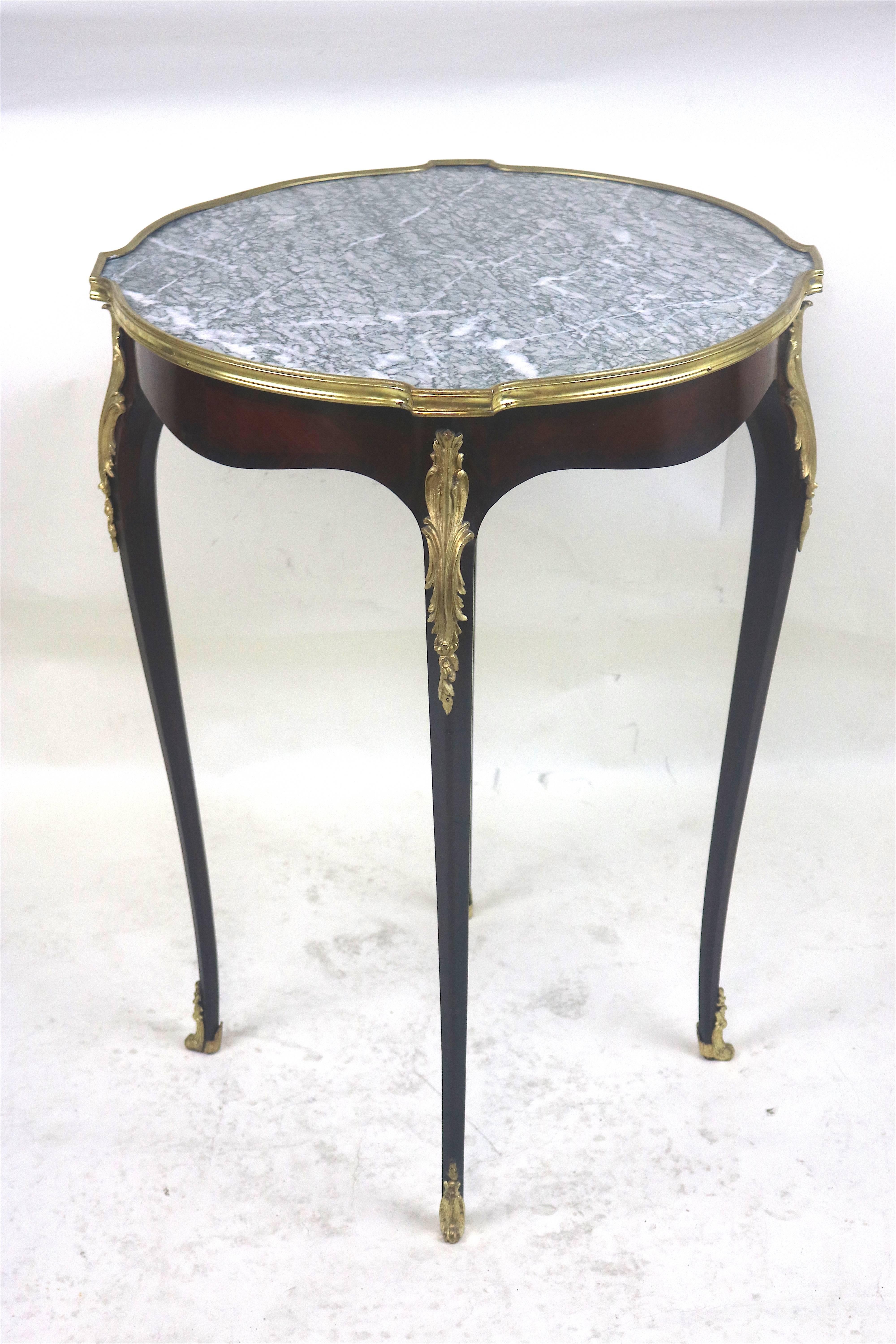 Late 18th/early 19th century Refined  beautiful Louis XV style Gueridon Table  with lovely patina, mahogany marquetry with darker mahogany bordered inlay design, refined proportions-fine gilt bronze trim, ormolu cabriole leg mount and ormolu clad