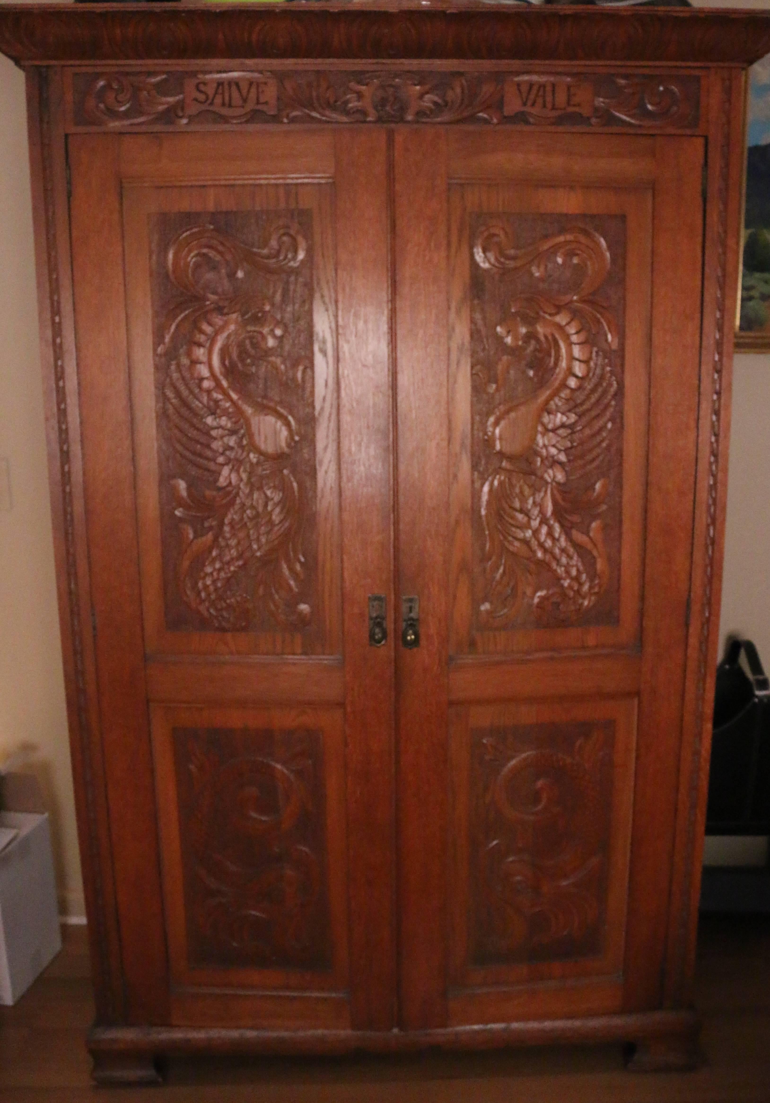 Scottish Light Oak Carved Scottish Armoire...finely carved details.
“Good fortune goes to the bold”- Audaces Fortuna Juve is written in Latin in the carved crest at the top of the armoire which is a Scottish crest.
Superb carvings on top and bottom