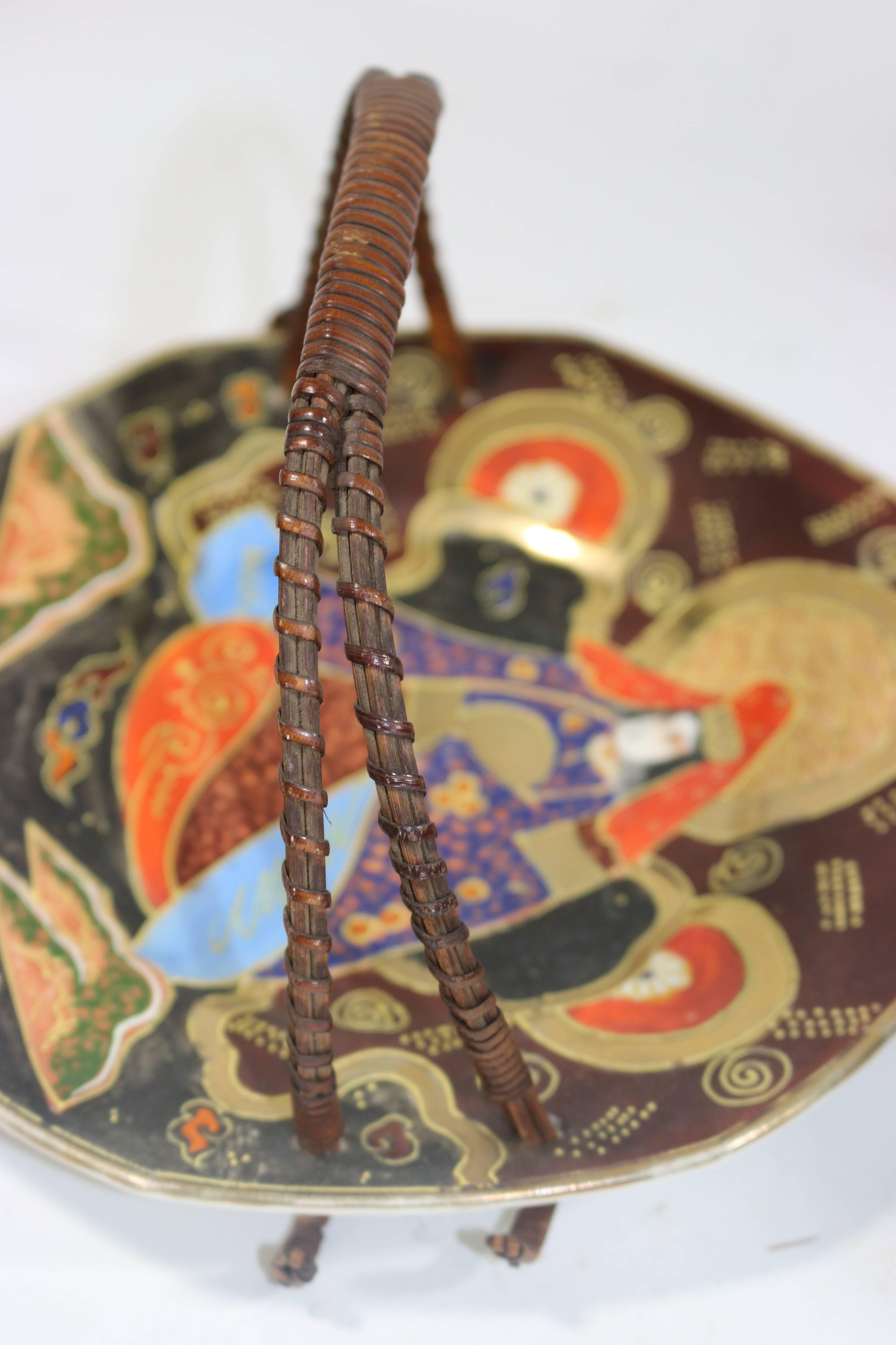 Highly decorative beautiful vintage serving plate or bowl - Japanese Satsuma woven handle with relief decoration, painted, enameled gilt surfaces covered with continuous mythological scene in relief- outlined Empress in flowing robe, with clouds,