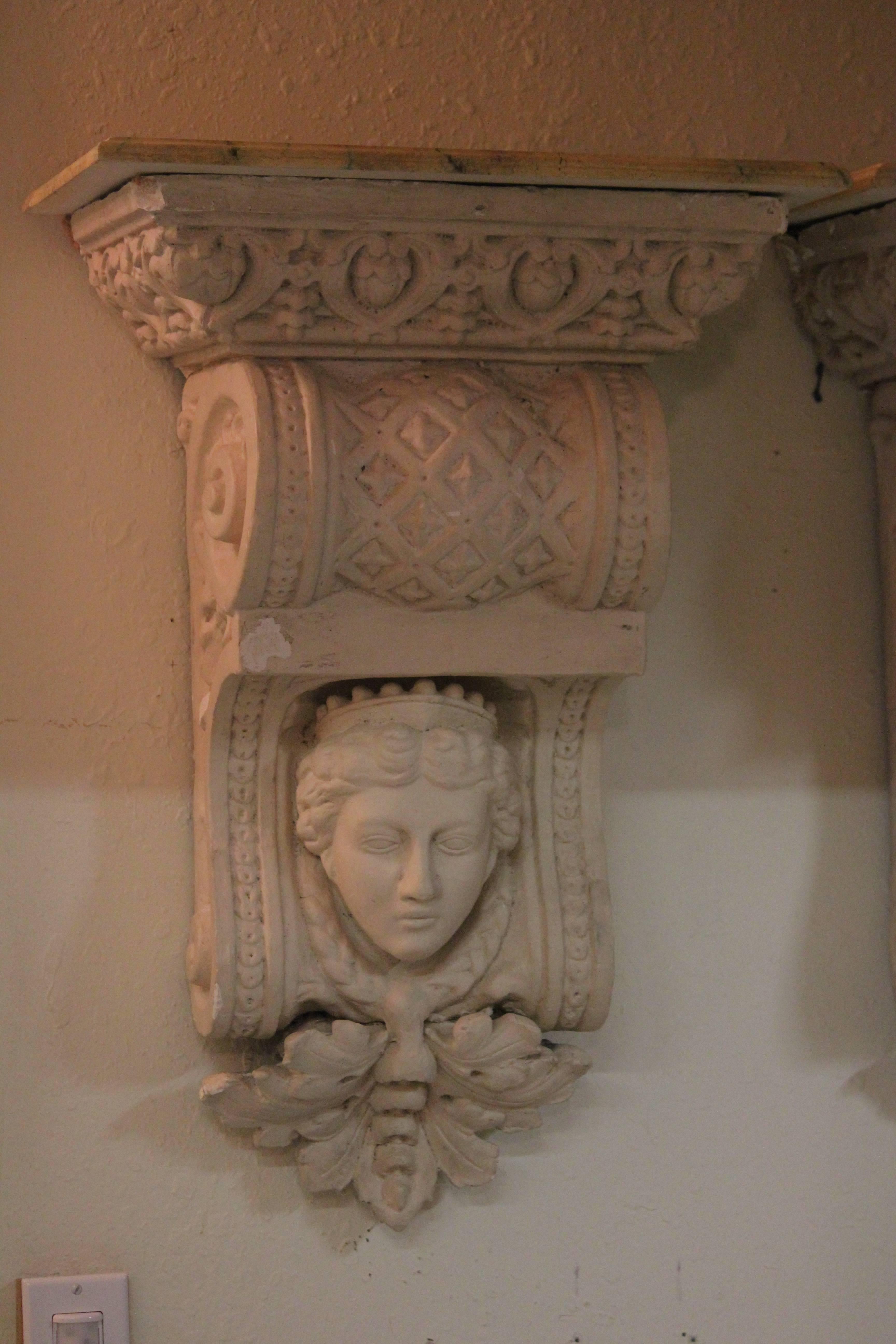 Extraordinary Vintage Very unique and gracious in form and style pair of plaster composition classical corbel Wall Brackets with faux painted wood shelf tops embellished with classical Maidens Faces..
Can be used for a wall hung console when you