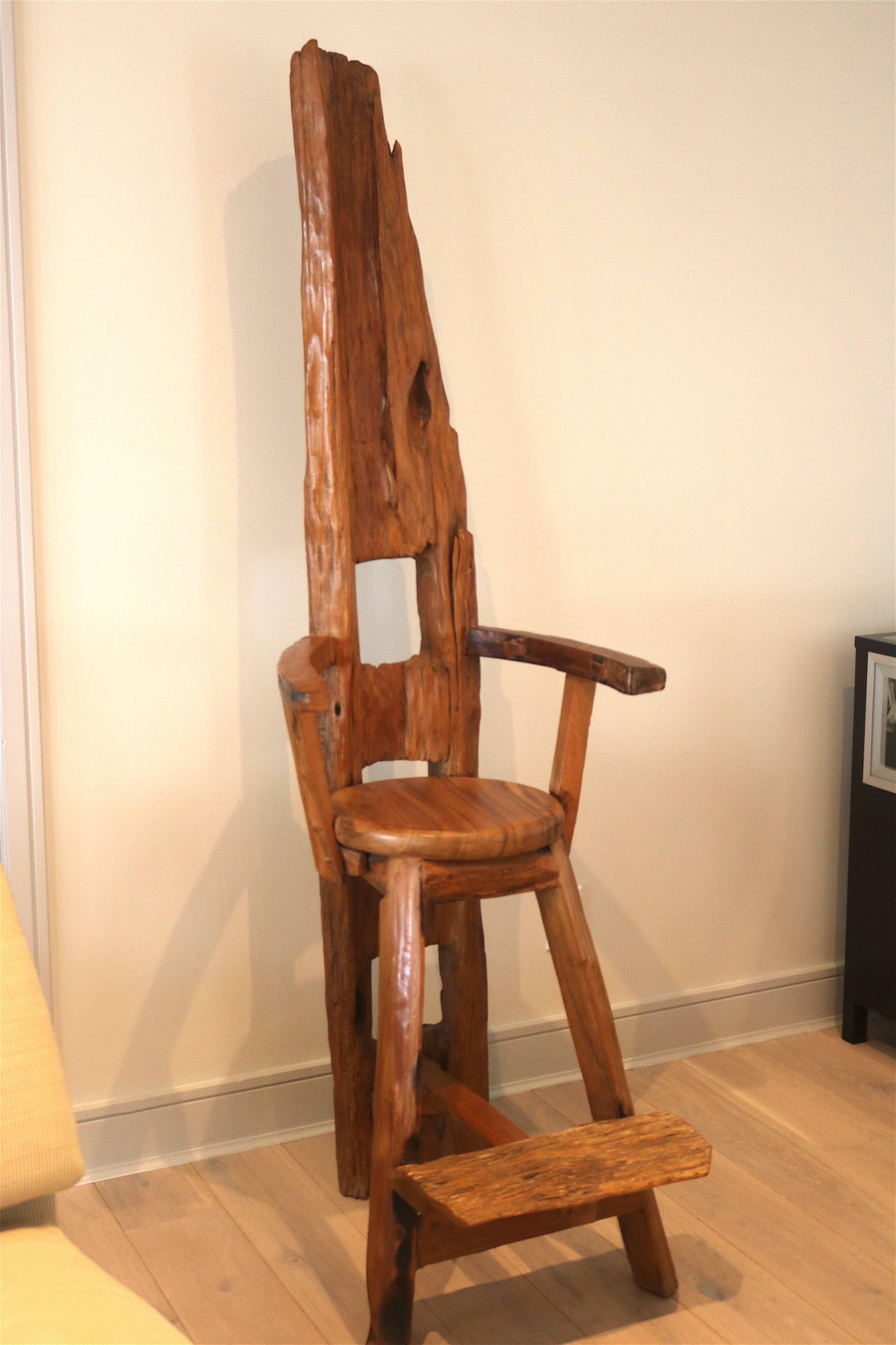 Inspired sculptural statement at 77 inches Tall!
Mesmerizing one-of-a-kind handcrafted wood chair carved and constructed from a huge tree log by a Master Artisan for the 'WoW' factor in your space. Step up on the footrest to reach the 30 