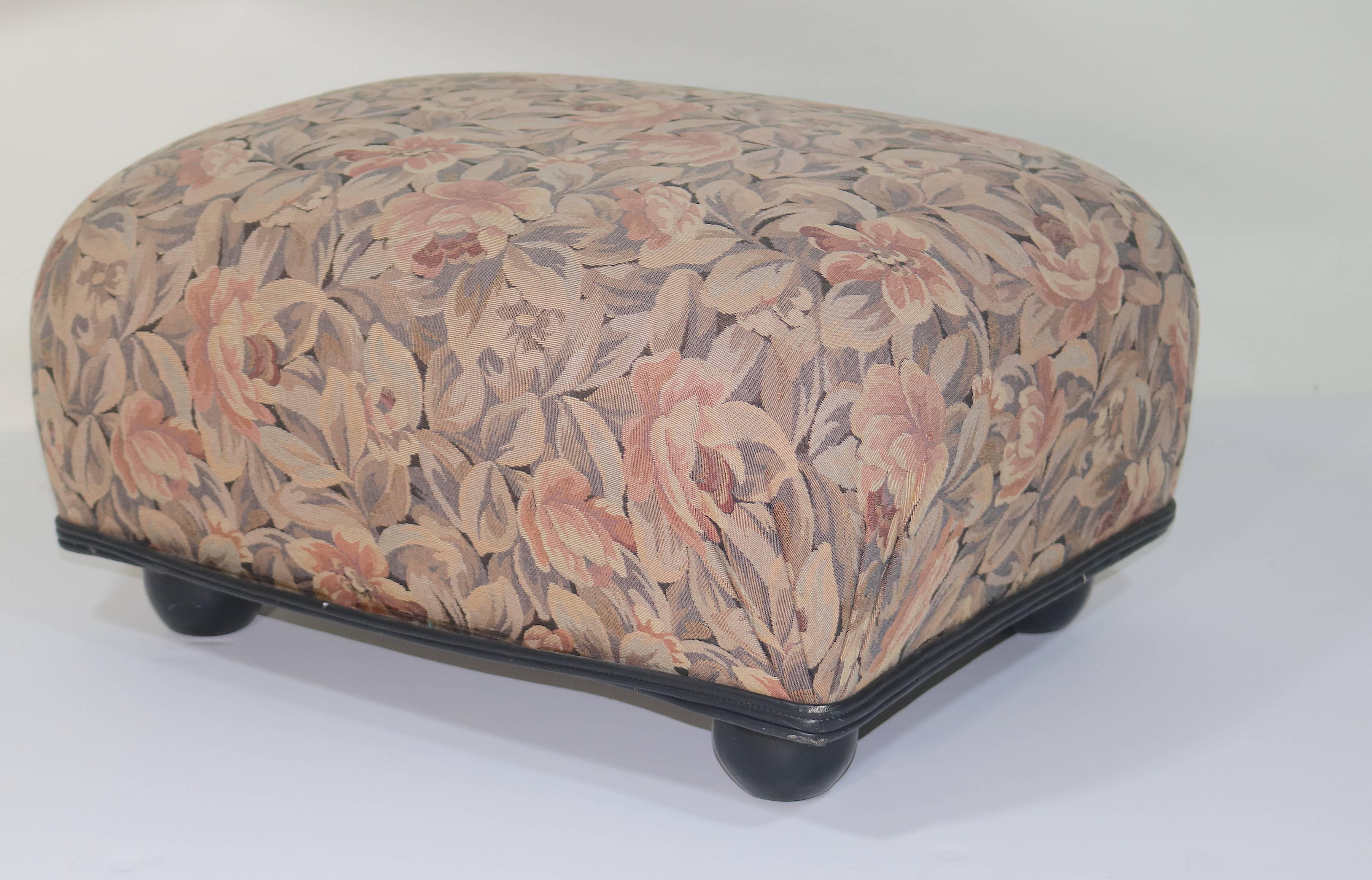 Pair of Ottoman/ Foot Stools Designed by Mars and Ronn Jaffe in a Floral Tapestry Woven Linen Upholstery, with Black Leather Double Welt Trim and Bun Feet. circa 1980

Noted artist and designer Ronn Jaffe's work has been created for clients such as