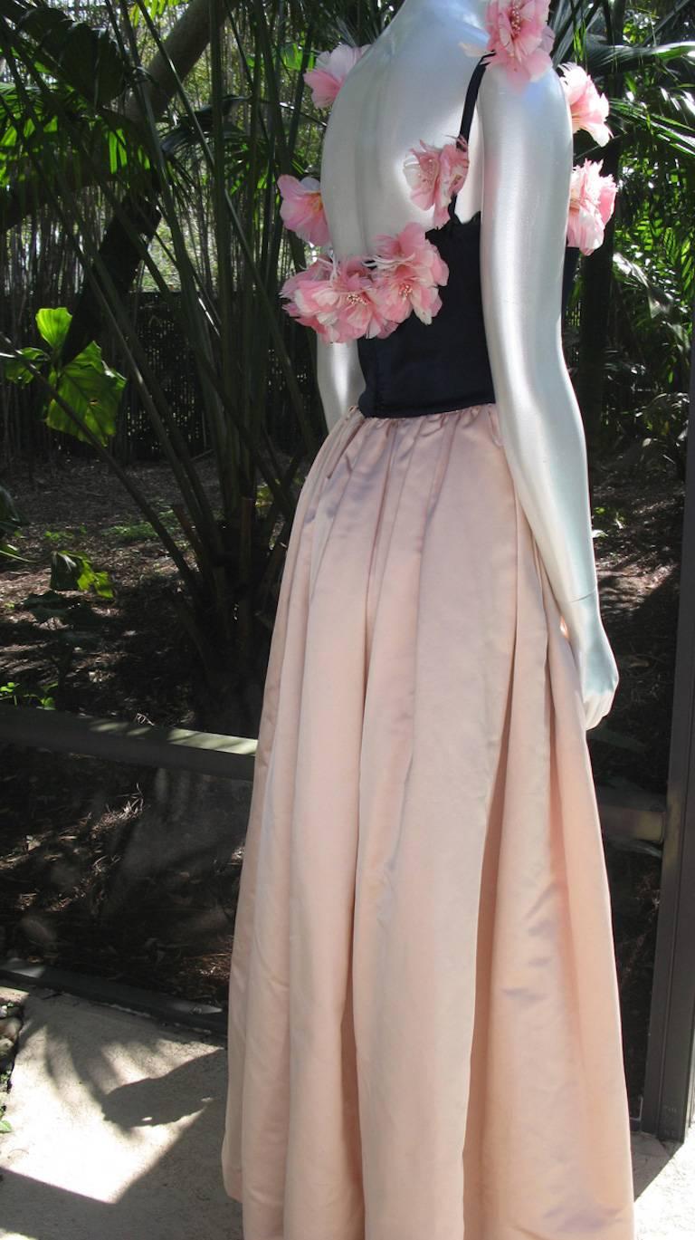 Be the Stunning sexy Ingenue in this intage George Stavropoulos evening gown- black velvet spaghetti strap bodice embellished with gorgeous pink and white all feather flowers front to back. The gathered pale pink fine silk taffeta skirt sets off the