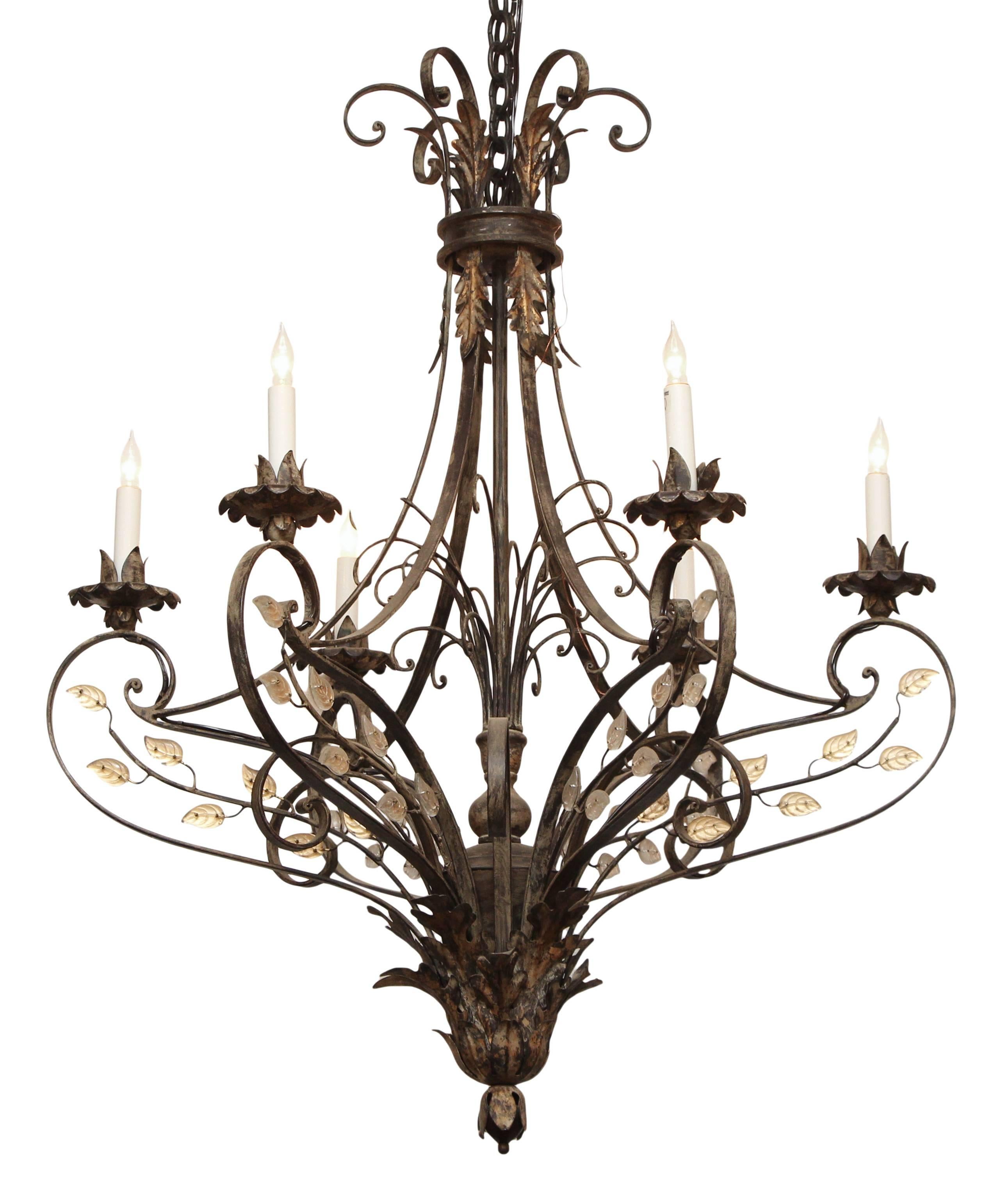 Wrought iron six-arm chandelier with crystal leaf details done in a gold leaf finish. This item can be viewed at our 302 Bowery and 5 East 16th St. Union Square locations in Manhattan.