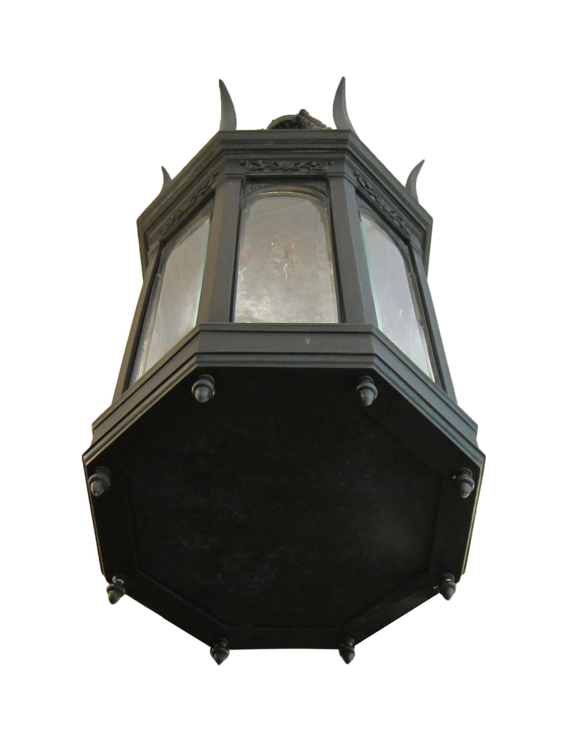 1900s American made octagon lantern pendant fashioned out of bronze patina with beveled glass and presented in a Gothic style. This item can be viewed at our 5 East 16th St, Union Square location in Manhattan.