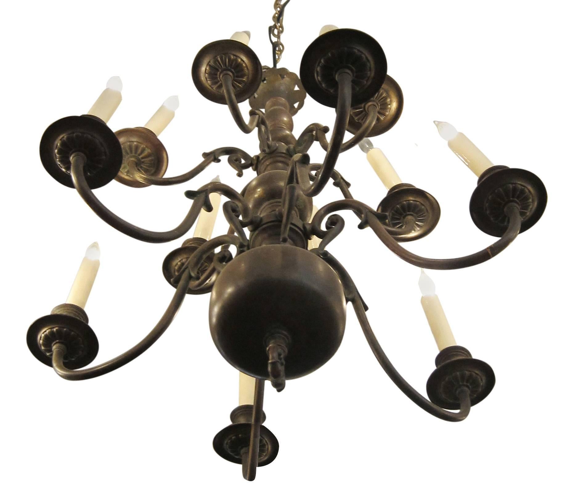 Oil rubbed bronze Dutch Colonial style chandelier with 12 lights. American made in the 1900s. Cleaned and rewired. Please note, this item is located in one of our NYC locations.