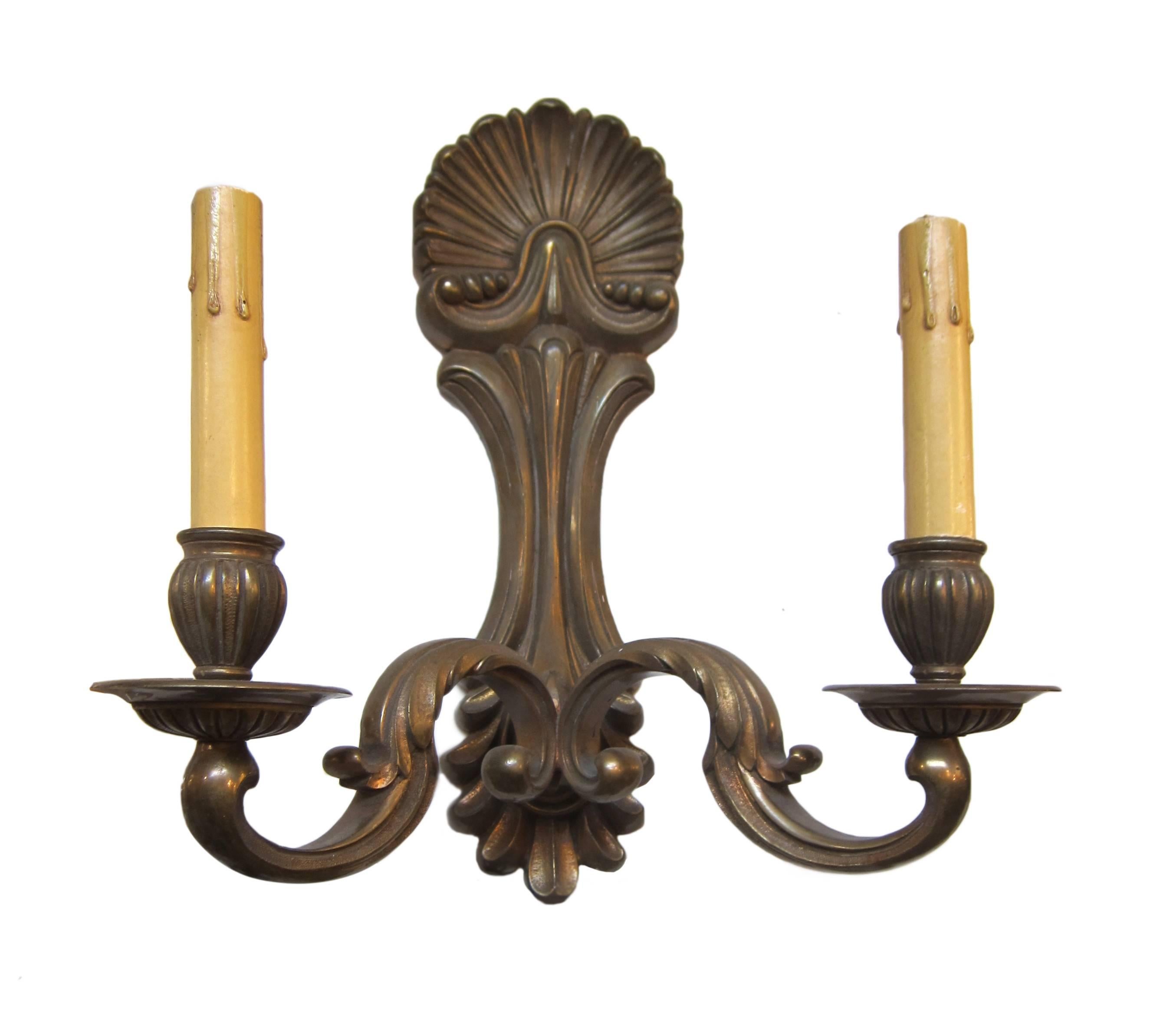 1920s pair of bronze two-arm sconces. Priced as a pair. This can be seen at our 400 Gilligan St location in Scranton, PA.