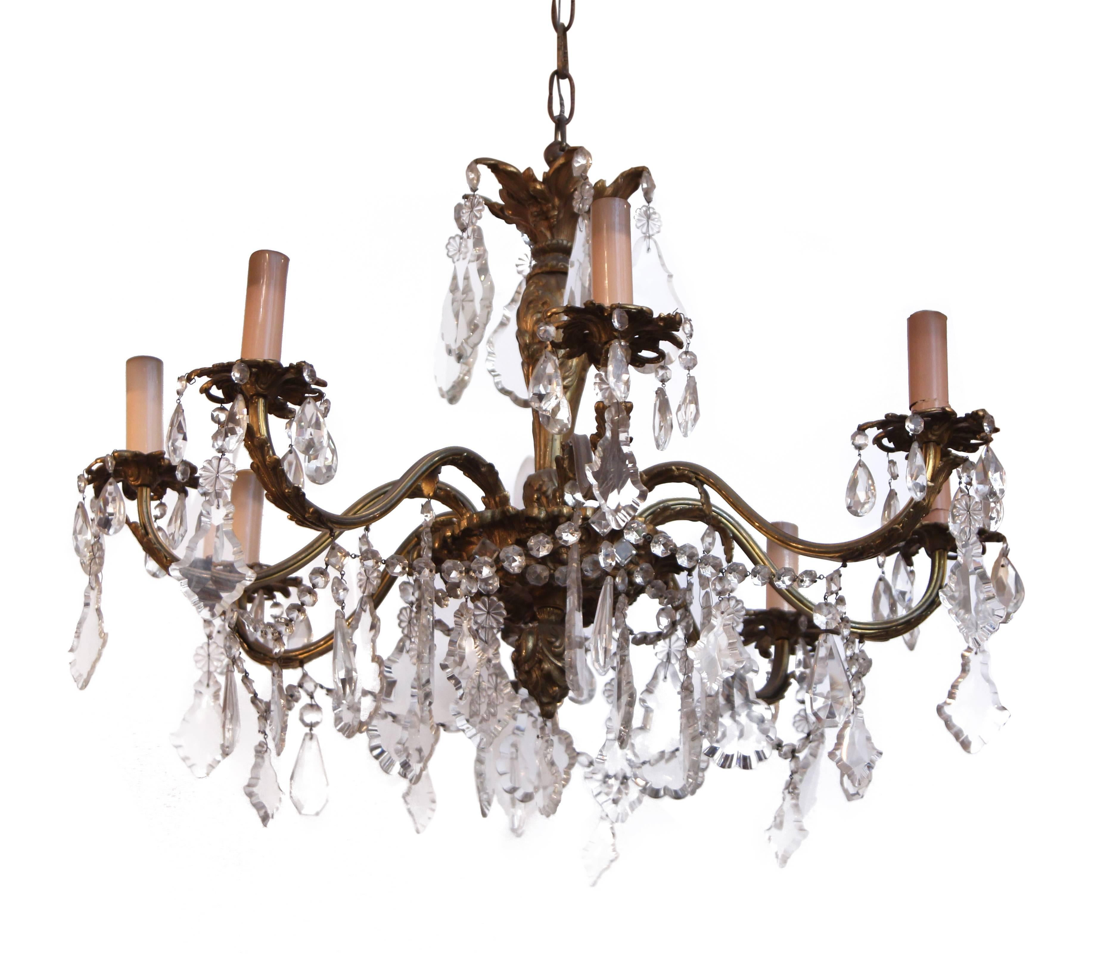 1920s bronze chandelier with eight arms and crystal detailing. This item can be viewed at our 5 East 16th St at Union Square in Manhattan.
