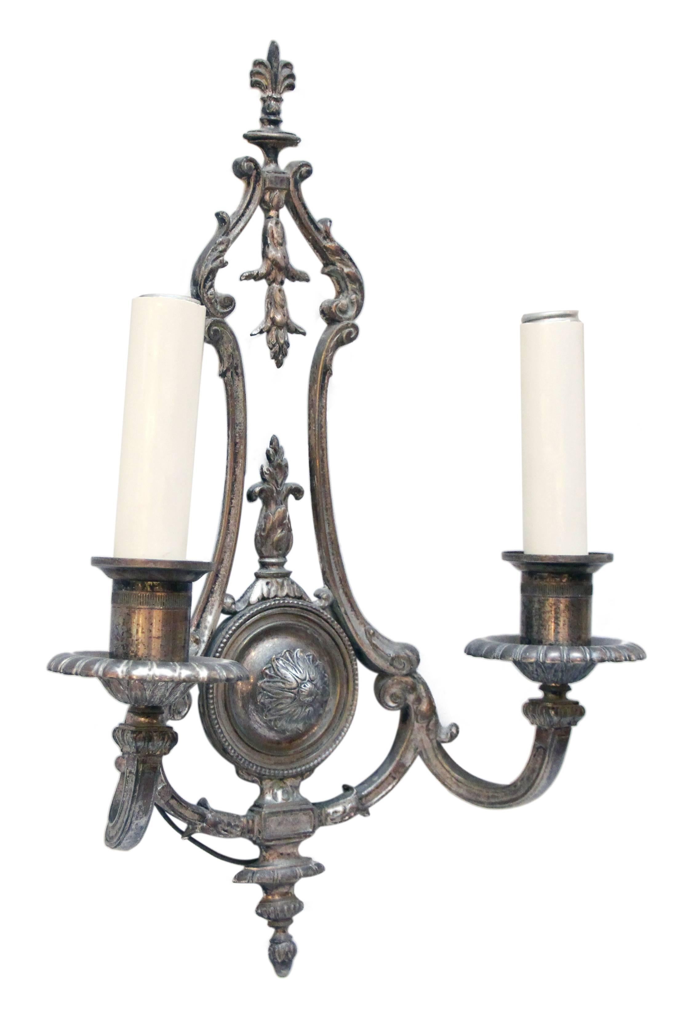 1910s pair of silver plated two-arm sconces. This item can be viewed at our 5 East 16th St, Union Square location in Manhattan.