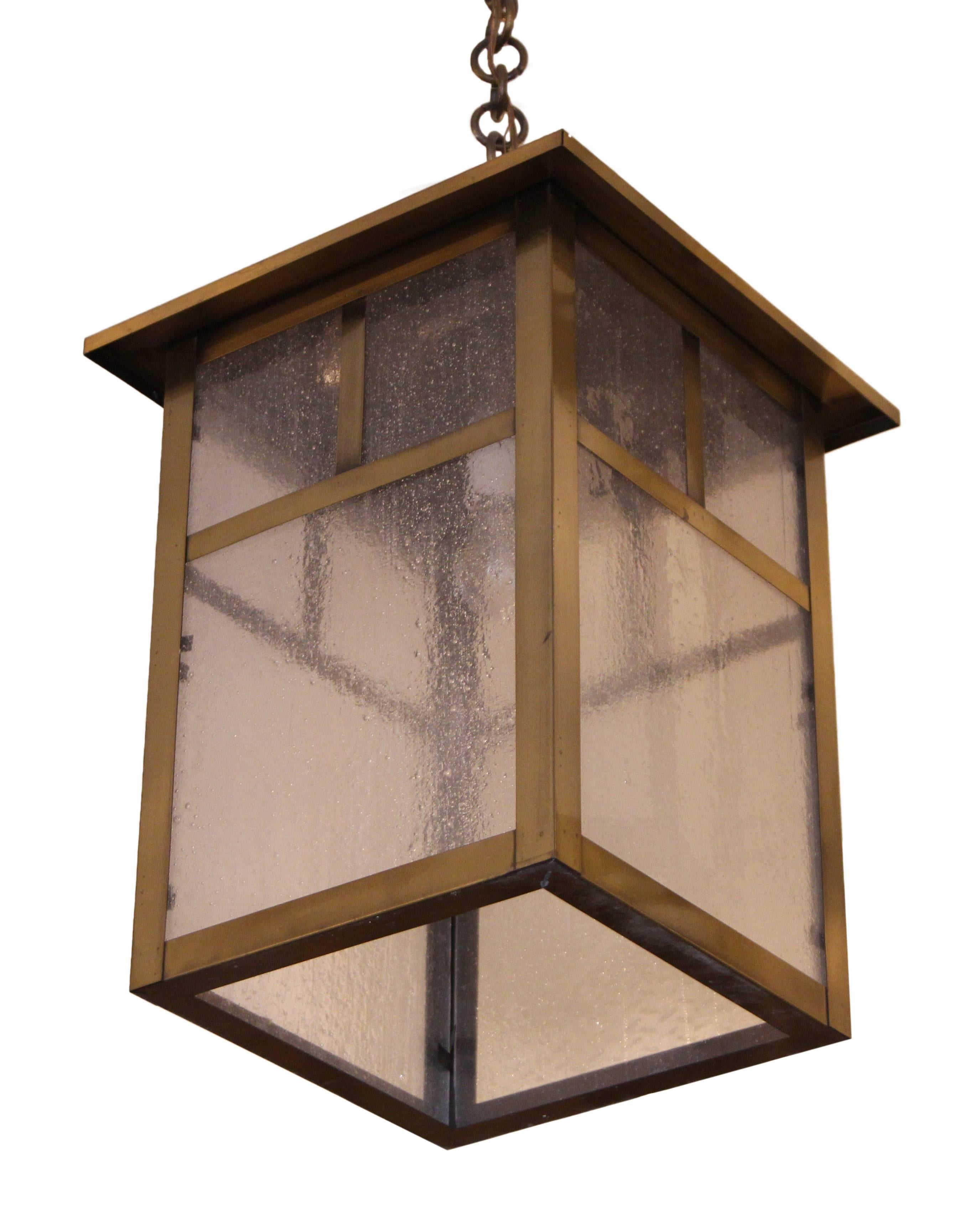 1980s Arts and Crafts brass lantern with textured clear glass. Requires one bulb. This item can be viewed at our 5 East 16th St, Union Square location in Manhattan.