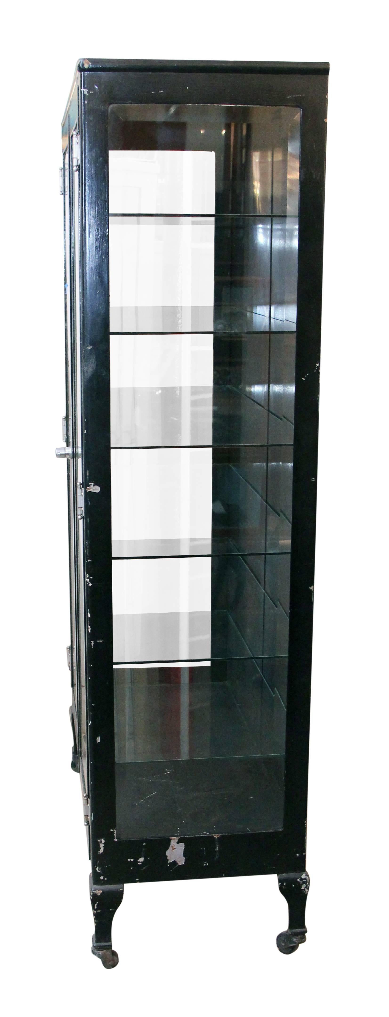 American 1920s Vintage Black Medical Cabinet with Glass Shelves and Beveled Glass Doors