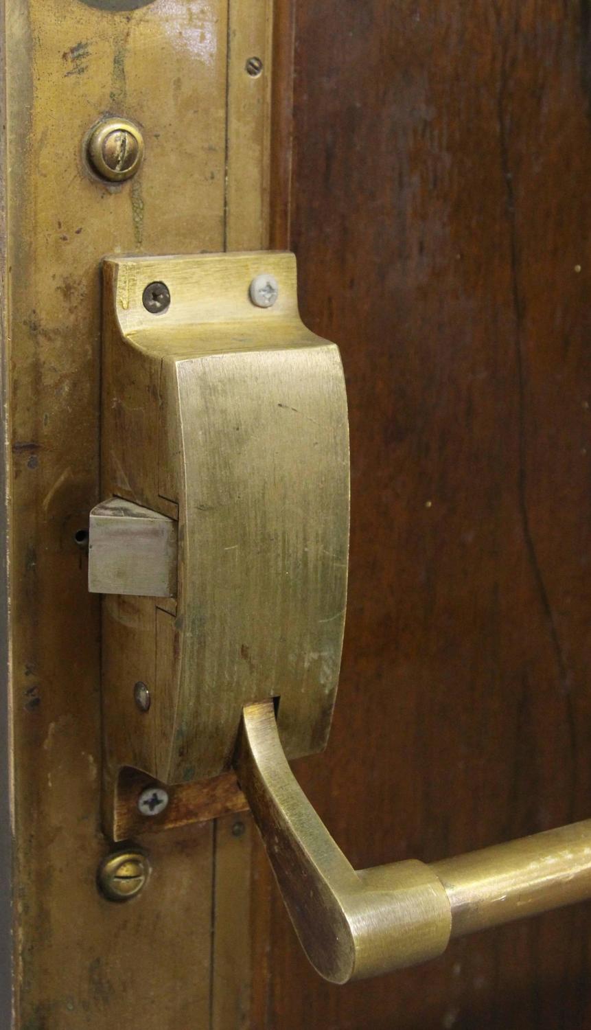 1920s Brass Lobby Door with Wood Veneer on One Side and Original Hardware For Sale at 1stdibs