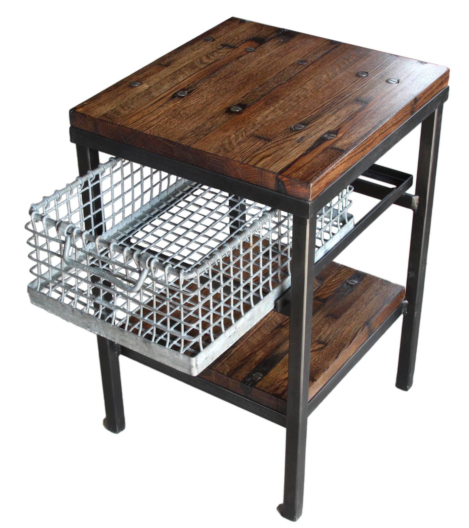 Unique Industrial style end table or end table made from reclaimed Industrial flooring featuring a galvanized basket for storage. Please allow 8-9 weeks for manufacturing.
Please note since each table is custom built each table varies slightly due