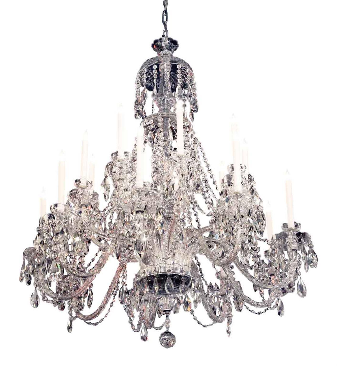 Large and elegant crystal chandelier with eighteen chiseled crystal arms and draping crystal beading, circa 1960s. Three available at time of listing. Price includes restoration. Please allow 1-2 weeks to process. Please specify the overall drop