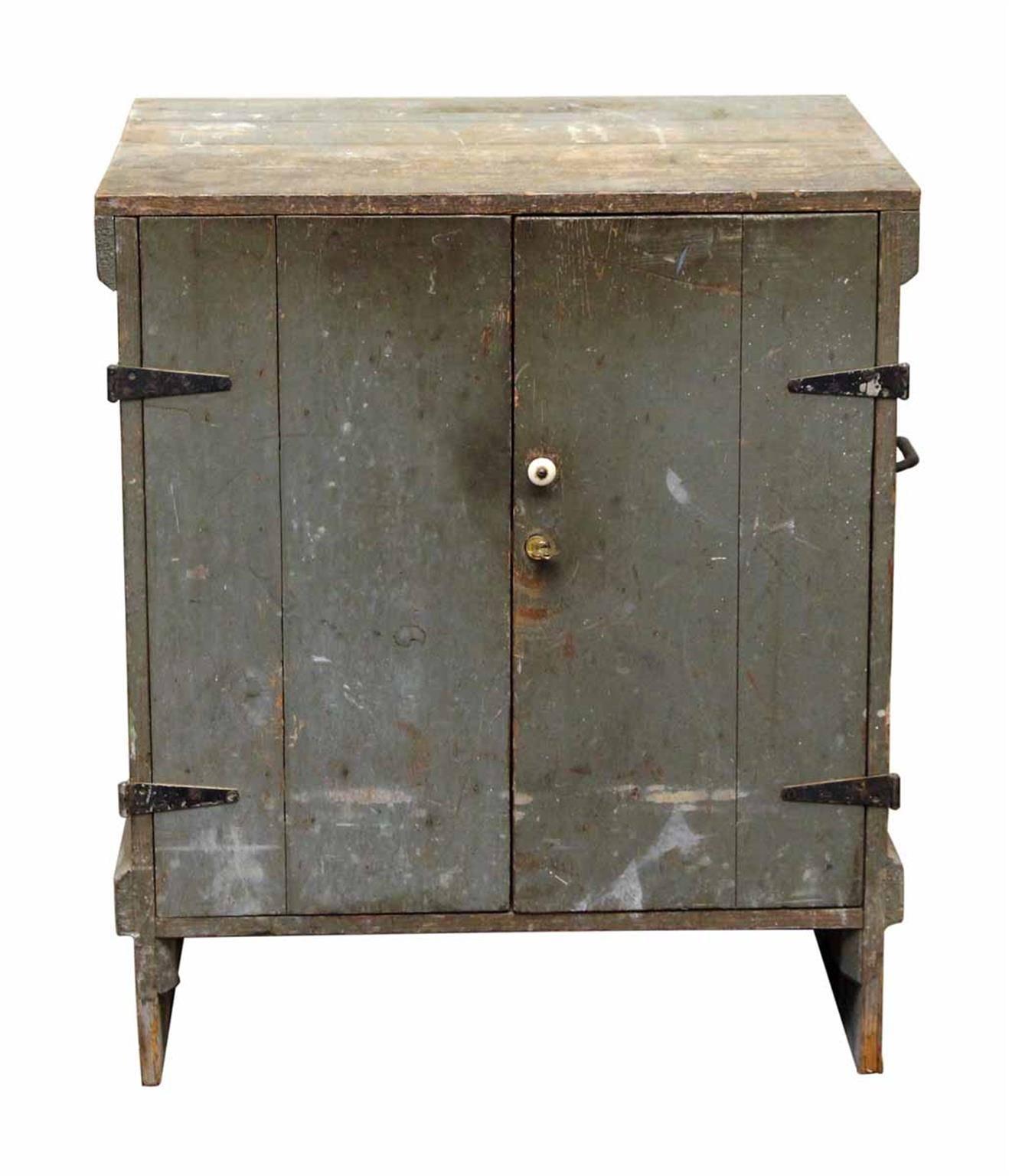 1920s antique wooden tool cabinet featuring five interior drawers, a porcelain knob, black iron hardware and original key. Nicely worn from age and use. This can be seen at our 1800 South Grand location in downtown Los Angeles..