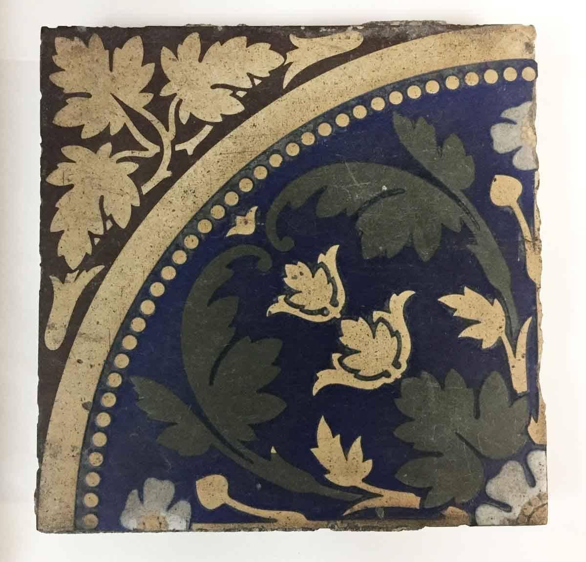 1920s red, blue green, tan and white in color. This includes 74 arched style tiles and 91 flower style tiles. It calculates to 40 square feet, with 165 tiles total. Some tiles have chips from salvaging, so allow 20% leeway. Priced as a set. This can