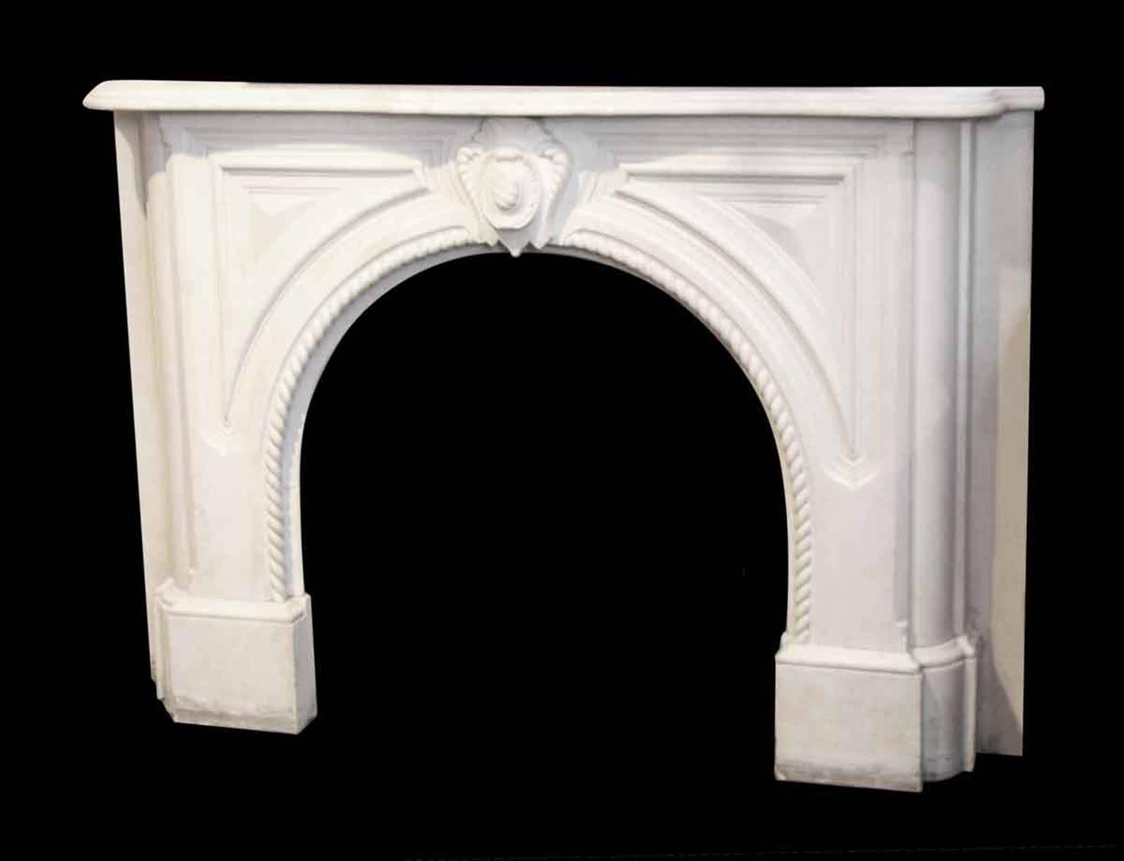 1905 white marble mantel with a beefy heavily carved profile and a rope design from Perry St in the West Village. This can be seen at our 302 Bowery location in Manhattan.