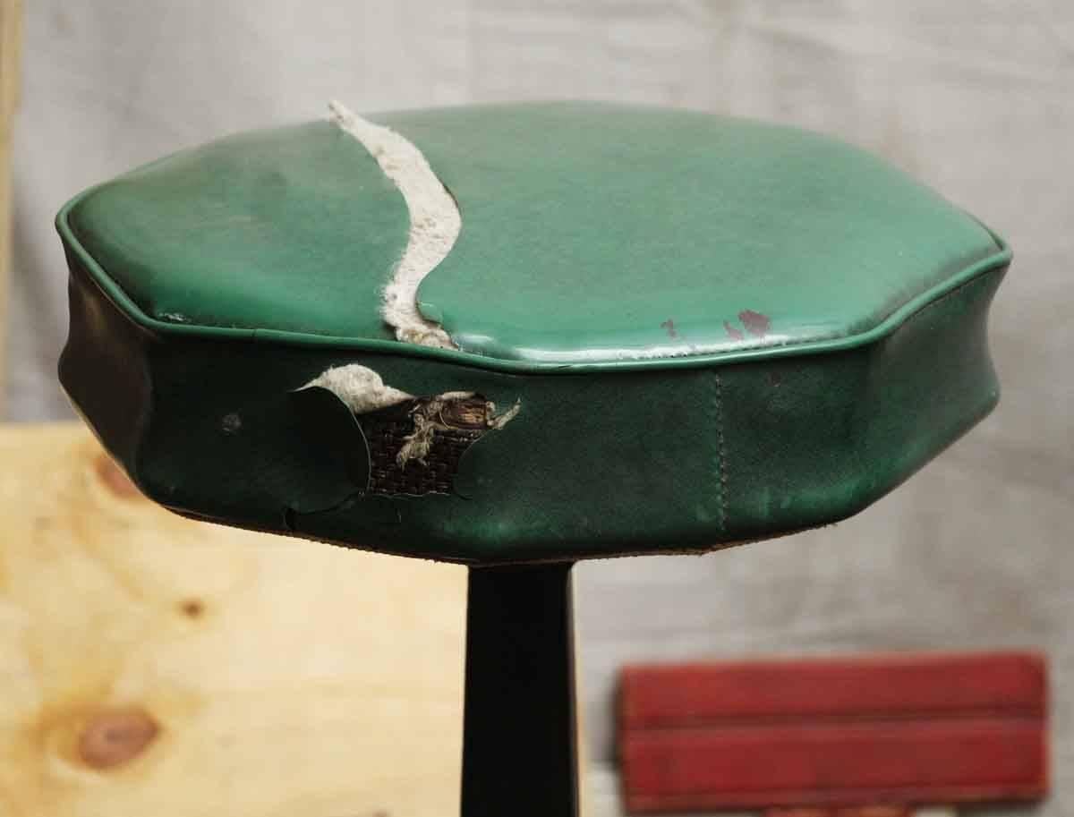 1890s five-seat soda fountain stool unit with a brass foot rail rest. Overall in good shape, but the seats are in need of reupholstering. The manufacturer is tagged on the bottom of the seat. This can be seen at our 400 Gilligan St location in