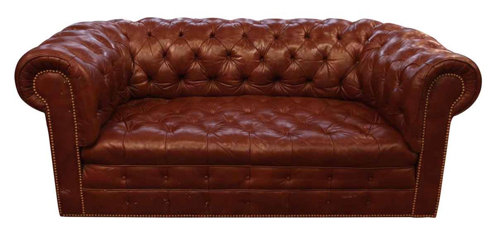 1970s, Hancock & Moore Chesterfield sofa in a rich brown leather with natural aged patina and light wear. Brass rivets adorn the frame and backside. This can be seen at our 149 Madison Ave location in Manhattan.