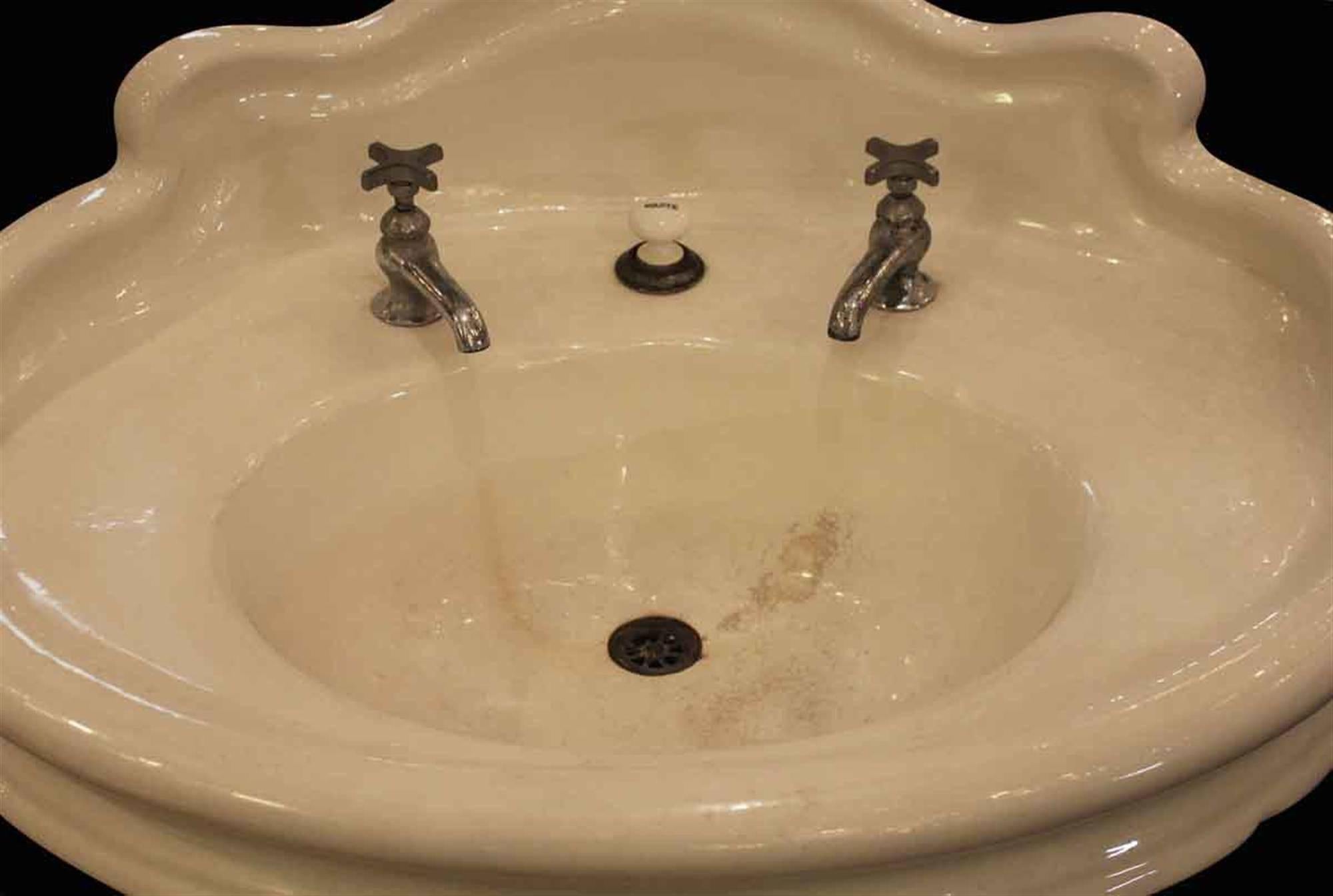 1900s earthenware pedestal oval sink with back splash and original hardware. This is a rare find in very good condition. This can be seen at our 149 Madison Ave location in Manhattan.