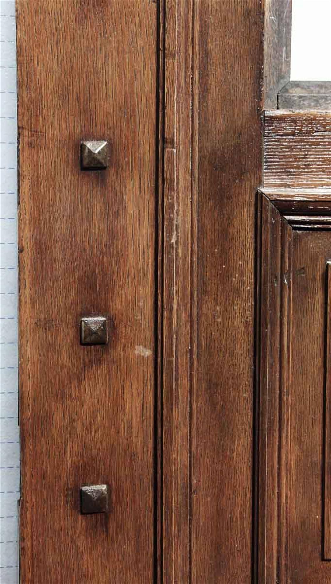 This is an especially interesting door! It's wide and made of quarter sawn oak on one side of the door and a different wood on the other side of the door. The original bronze ornate door hardware is still intact on one side as well as the original