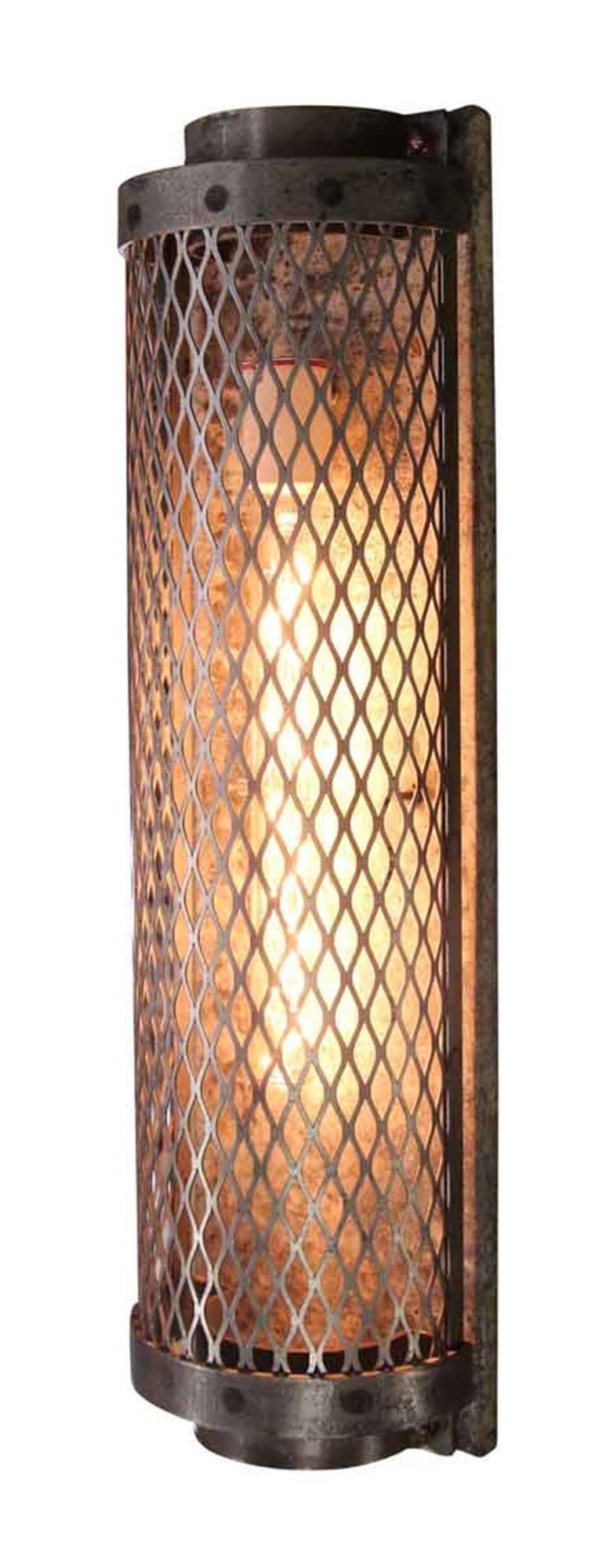 Sconce made with an expanded sheet steel cage, uses two long filament bulbs for a great Industrial look. Small quantity available, please inquire. This can be seen at our 5 East 16th St location on Union Square in Manhattan.