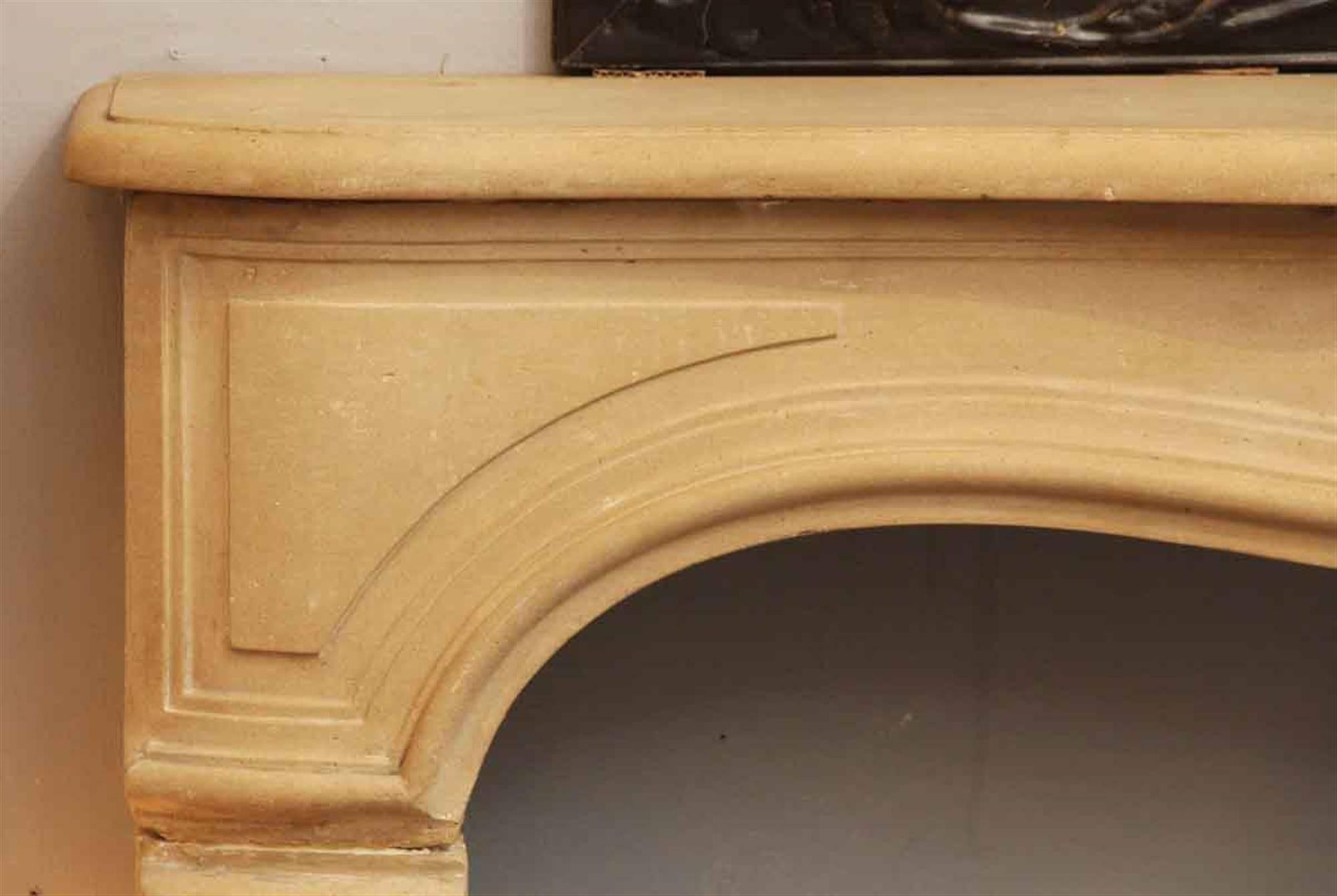 Late 20th Century Tan Neoclassical Style Limestone Mantel with Carved Details