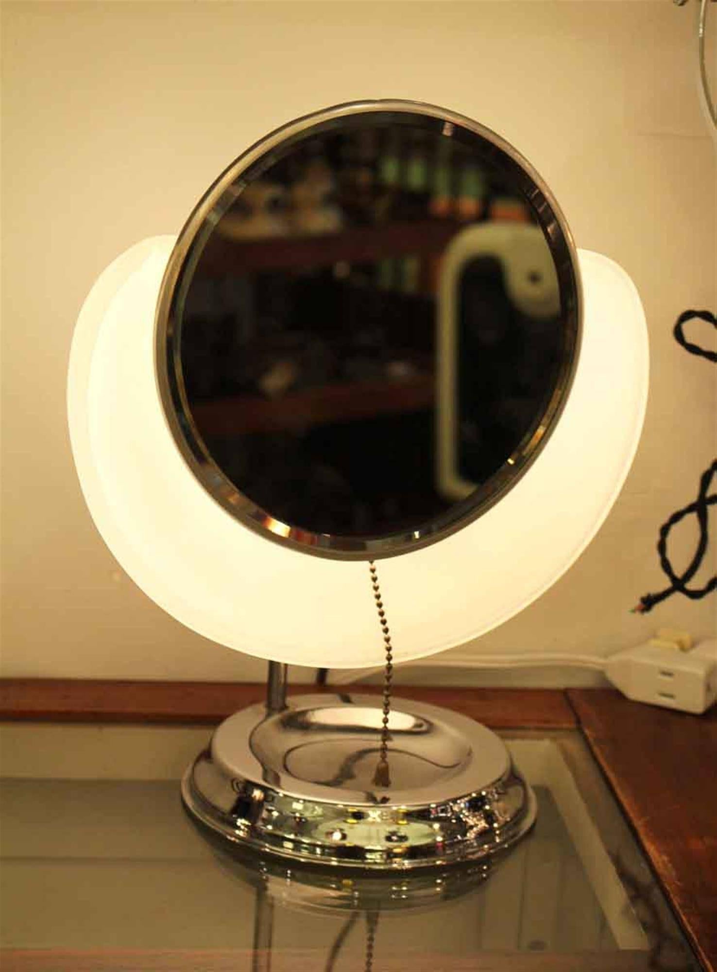 1930s adjustable bathroom standing shaving mirror with light and frosted shade. This can be seen at our 2420 Broadway location on the upper west side in Manhattan.