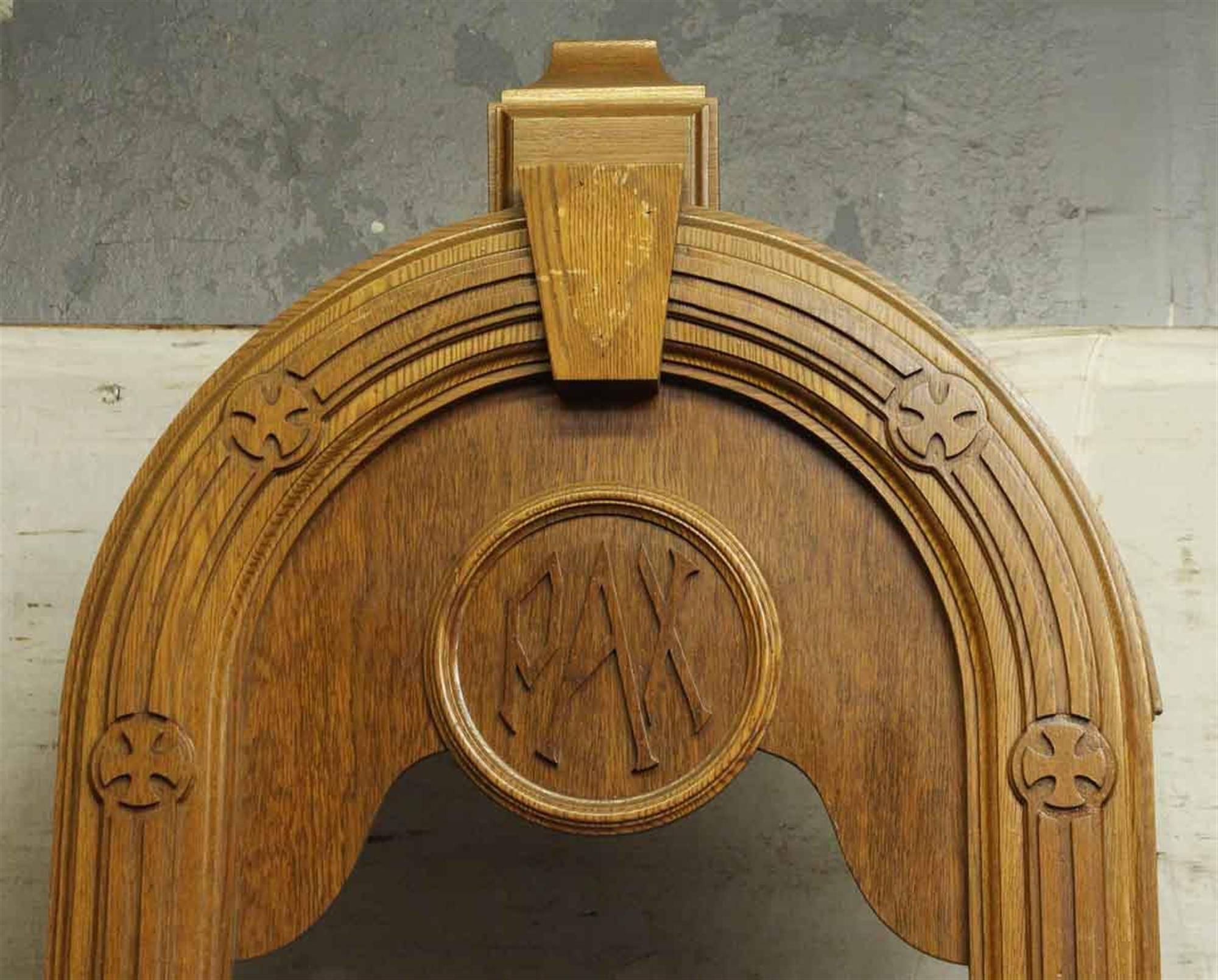1940s large oak confessional door with PAX monogram. This can be seen at our 400 Gilligan St location in Scranton, PA.