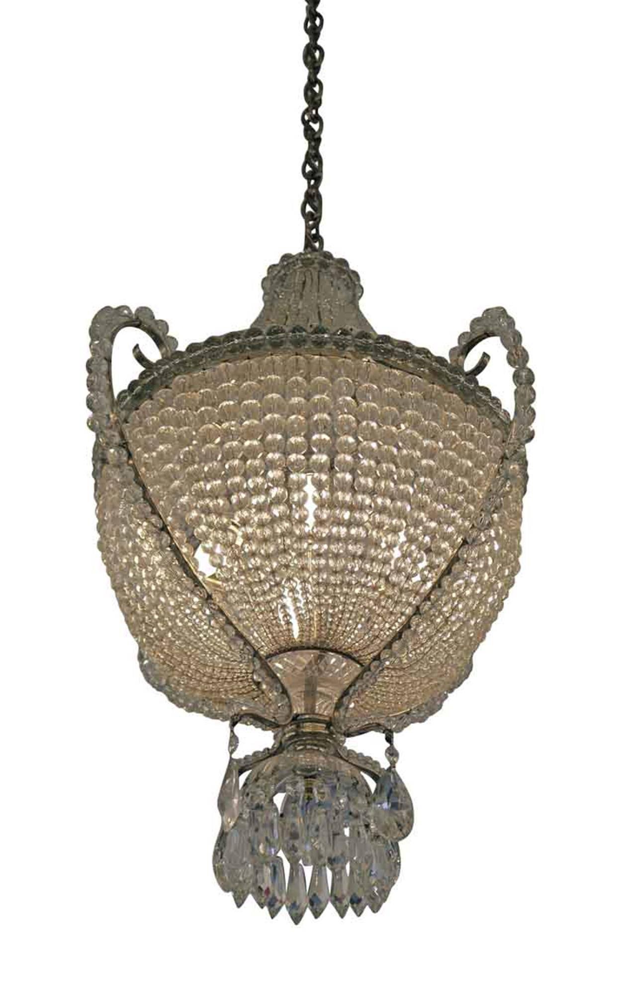 1920s crystal basket chandelier made of beaded crystals. This can be seen at our 302 Bowery location in NoHo in Manhattan.