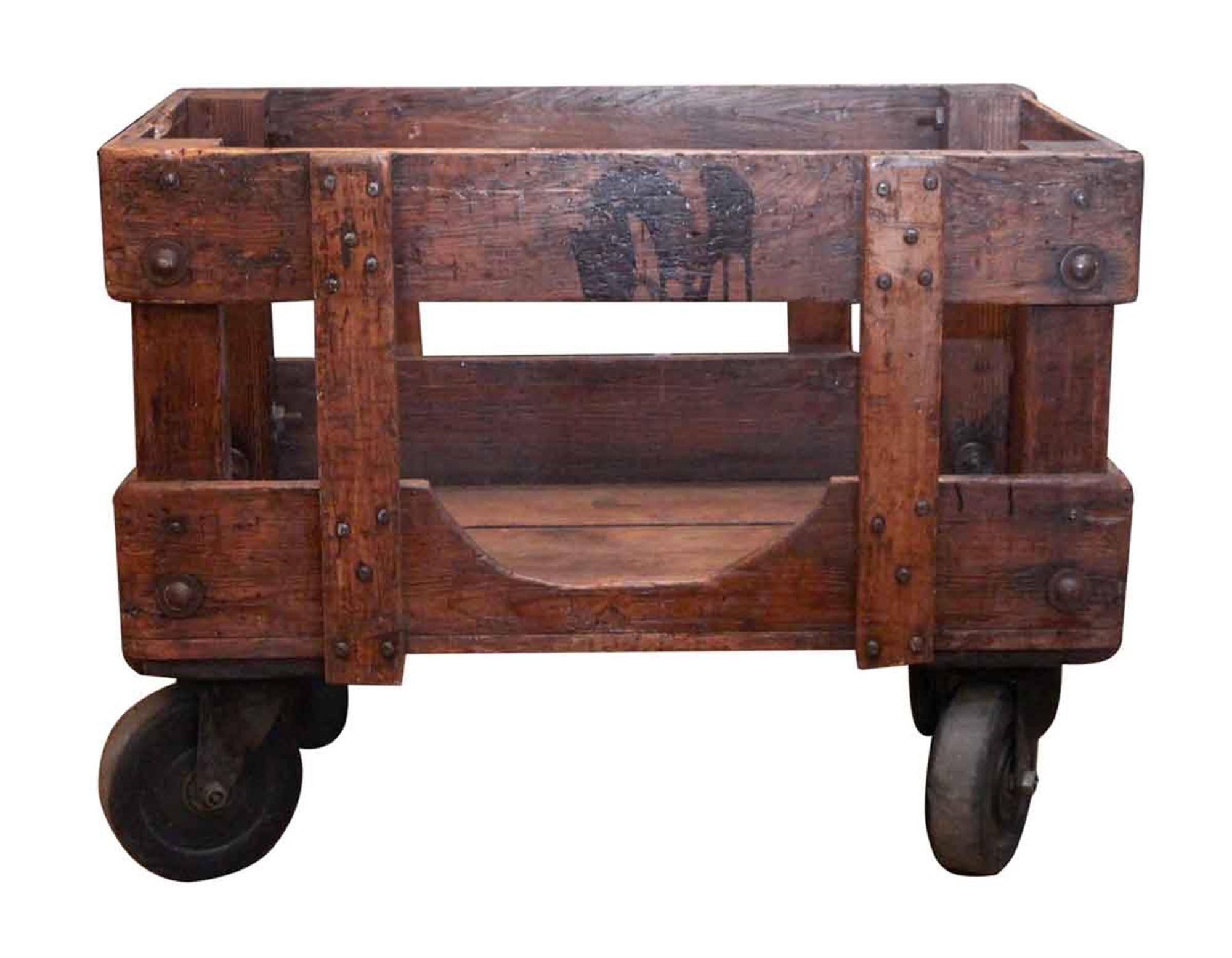 1890s wooden Industrial wooden factory cart with cast iron wheels. Refinished. This can be seen at our 302 Bowery location in Manhattan.