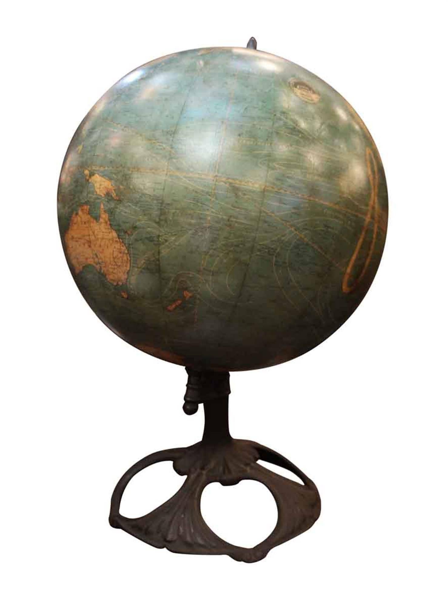 Antique Art Nouveau tabletop Johnson terrestrial globe with a cast iron base. W. & A.K. Johnston was among the most important figures in the production of globes in the late 19th century and early 20th century. Although a British manufacturer, they