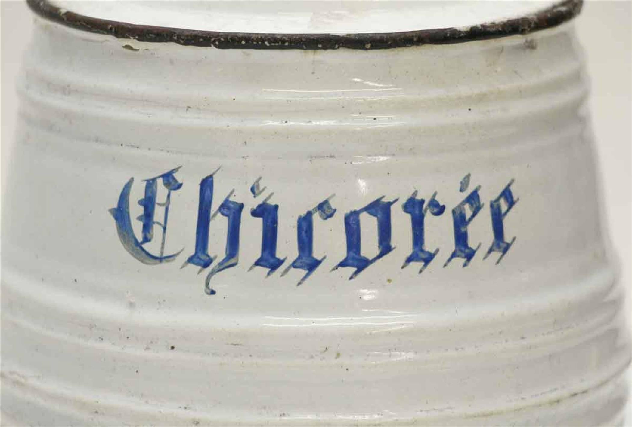1950s white metal French pot for chicoree in blue lettering. There is some wear from age and use. Chircoree (French) or chicory (English) is added to the coffee to soften the bitter edge of the dark roasted coffee giving it an almost chocolate