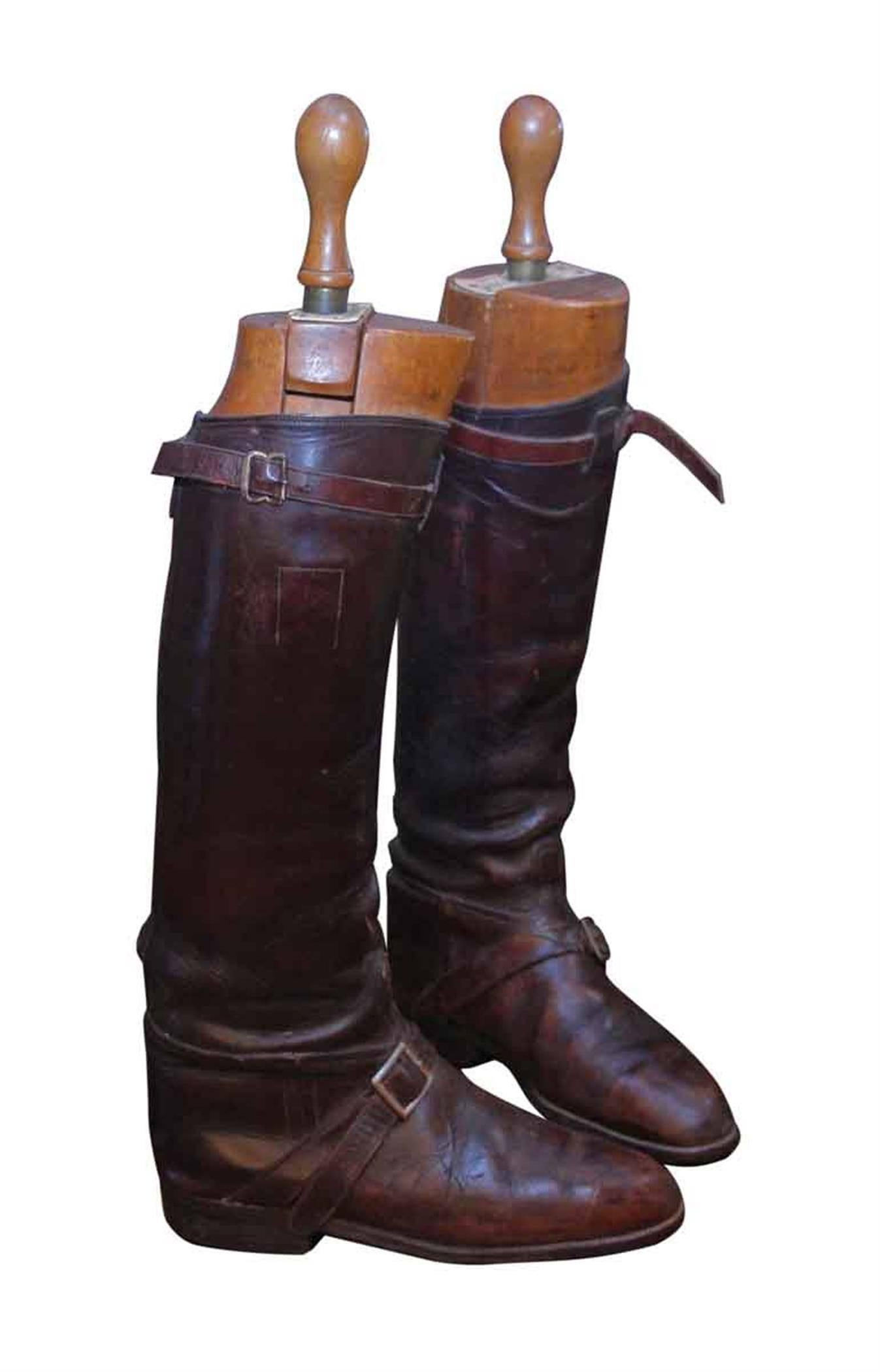 1950s pair of vintage English Polo brown leather boots with custom boot straps. The boots come with vintage, light wood toned Peal & Co. Ltd. stretchers. This can be seen at our 2420 Broadway location on the upper west side in Manhattan.