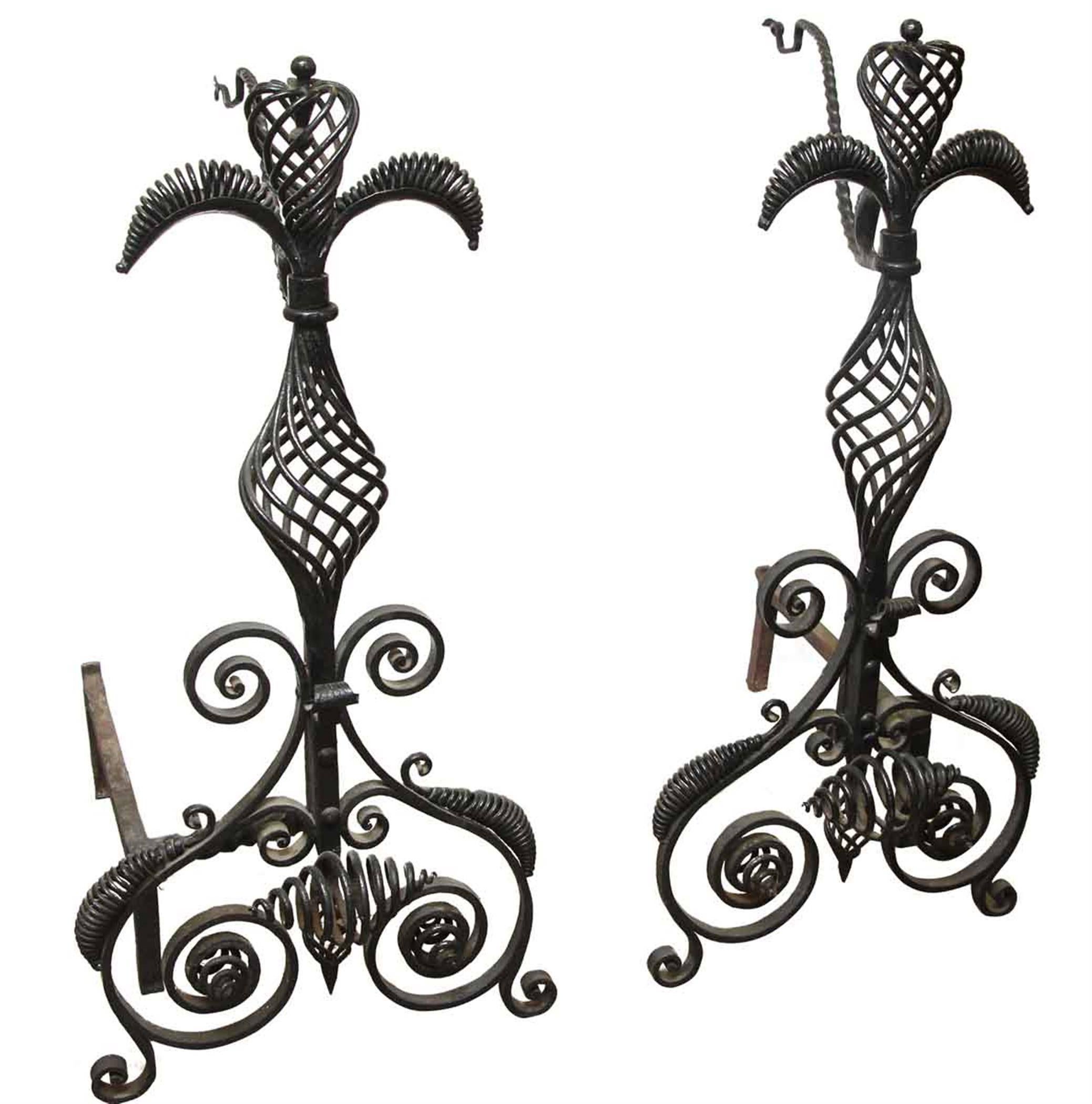 1880s blacksmith work on these all hand-wrought iron andirons for a fireplace. Priced as a pair. This can be viewed at one of our New York City locations. Please inquire for the exact address.