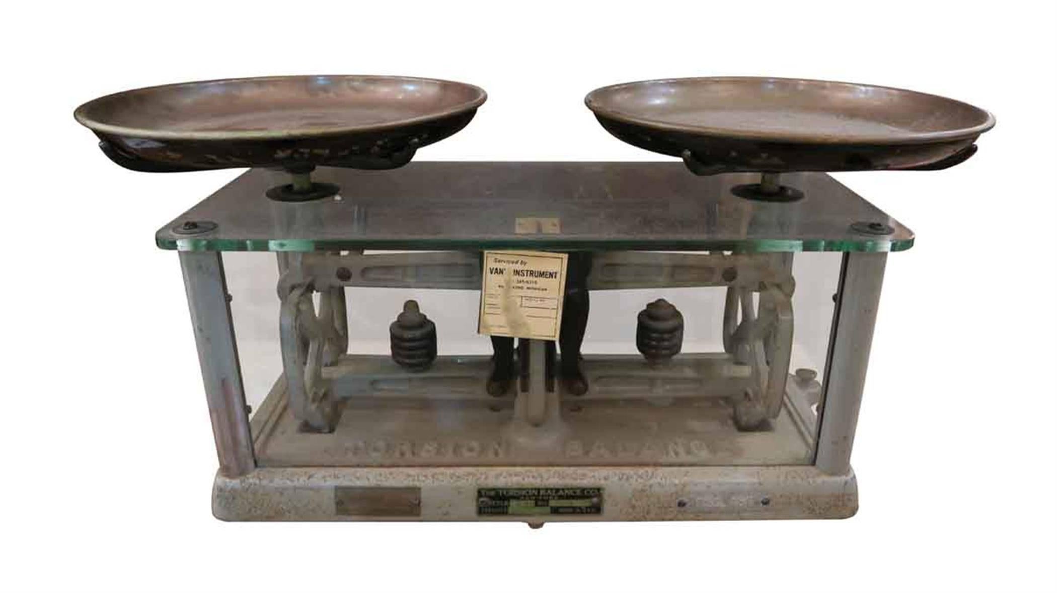 Made of glass, cast iron and brass. Made in the 1950s by The Torsion Balance Co. Made in USA. Style 253. This scale has a capacity of 10 pounds, a sensitiveness of three grains, and a graduated beam in front. It was extensively used for routine work