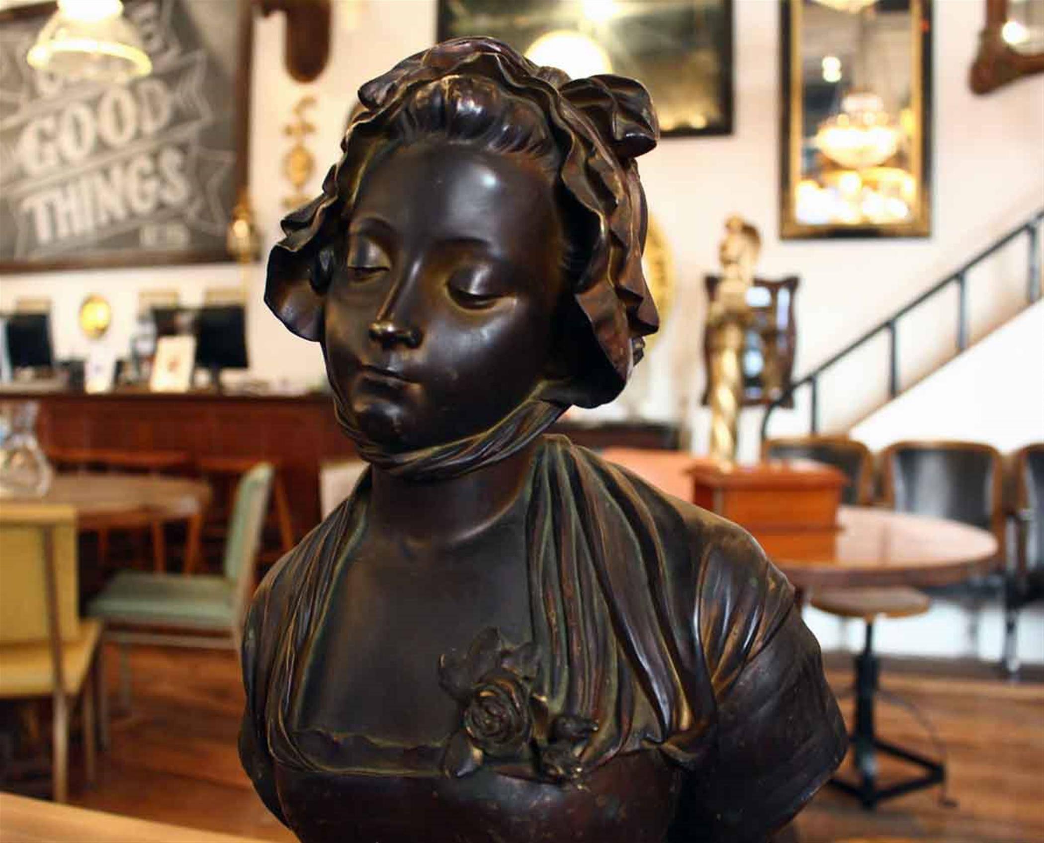 Bronze bust of woman with bonnet. Signed E. Laurent. French Romantic sculptor born 1832 died 1898. Please note, this item is located in one of our NYC locations.