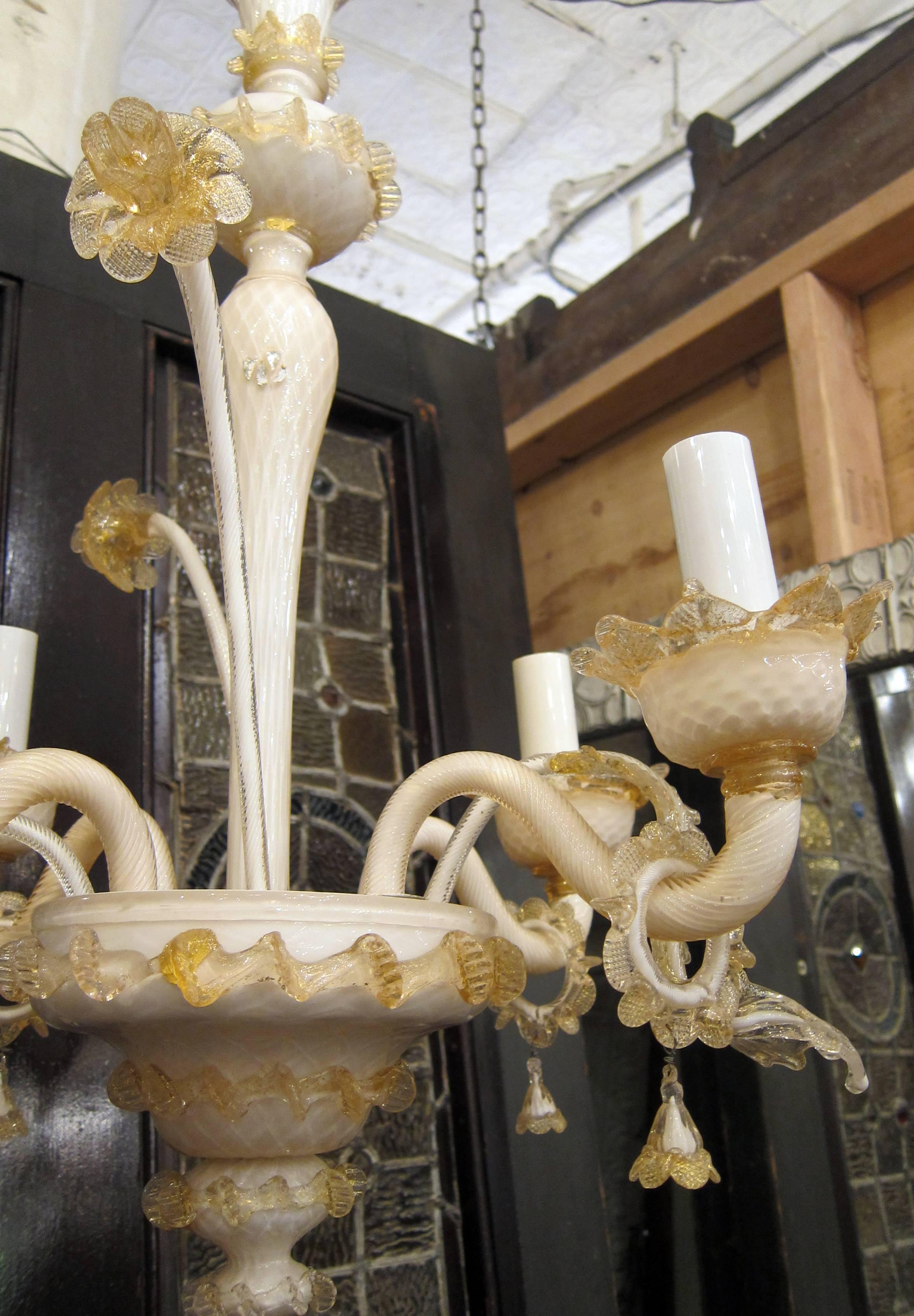 1950s Murano four-arm peach and off-white colored hand blown floral chandelier. This item can be viewed at our 400 Gilligan St location in Scranton, PA.